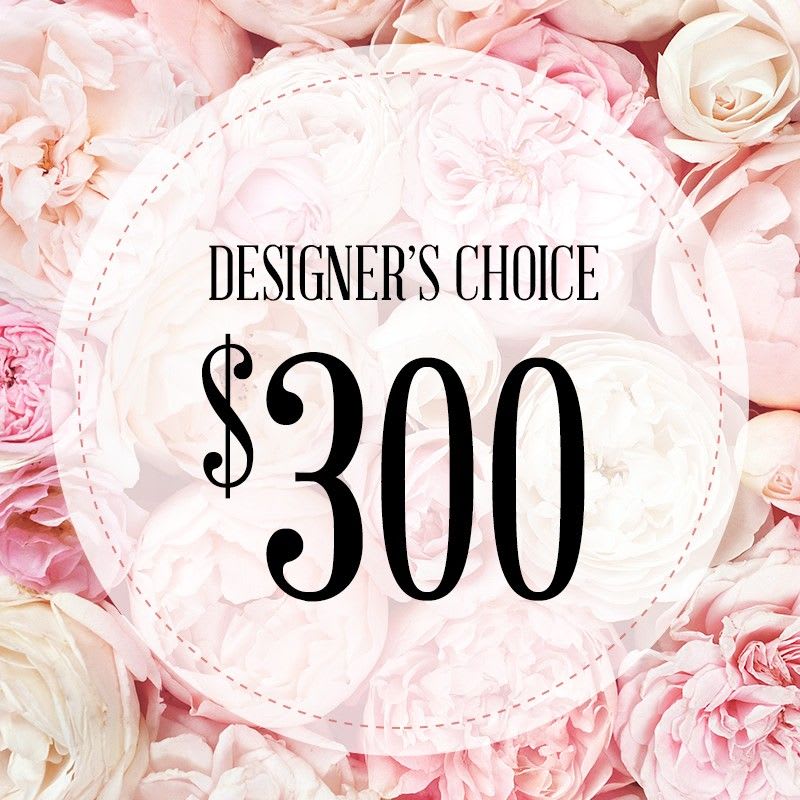 $300 Designer's Choice $300 Designer's Choice - A breathtaking display of seasonal blooms artfully arranged in a vase by our award winning designers' Ray and Christine.