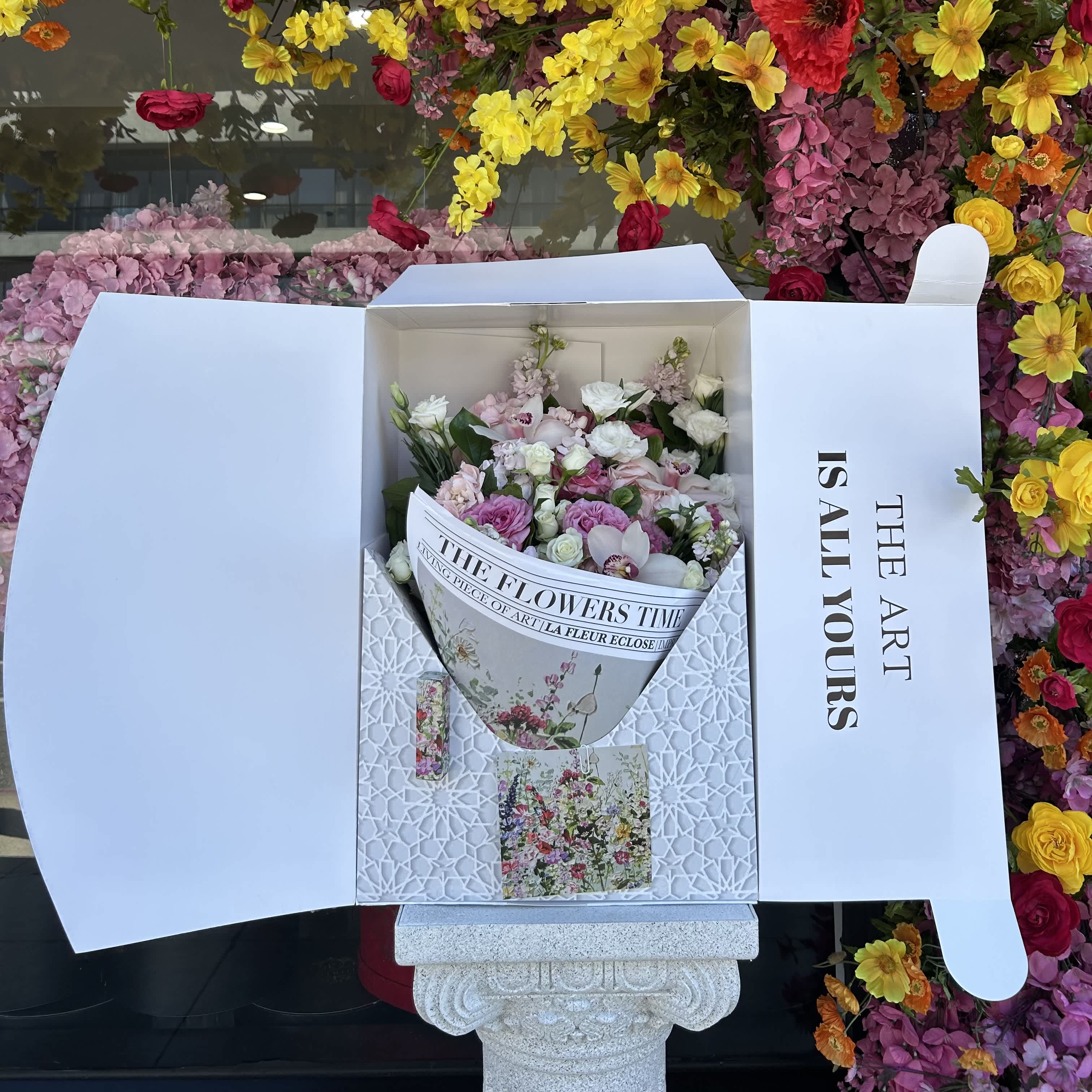 The Art IS ALL YOURS V - Introducing our The Art IS ALL YOURS  Hand-Tied Bouquet , in our custom designed box a vision of timeless beauty and grace. Immerse yourself in a world of delicate hues as shades of pink come together in this exquisite arrangement. Each bloom is hand-selected to create a harmonious blend that embodies the elegance and charm of this romantic color palette.