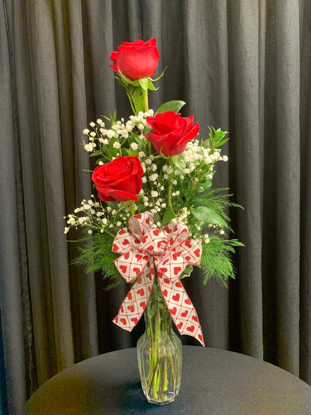 Three's a Charm - Need just a little something to say I love you... 3 Stunning Roses Arranged in A Budvase. Different Color Roses Available. 