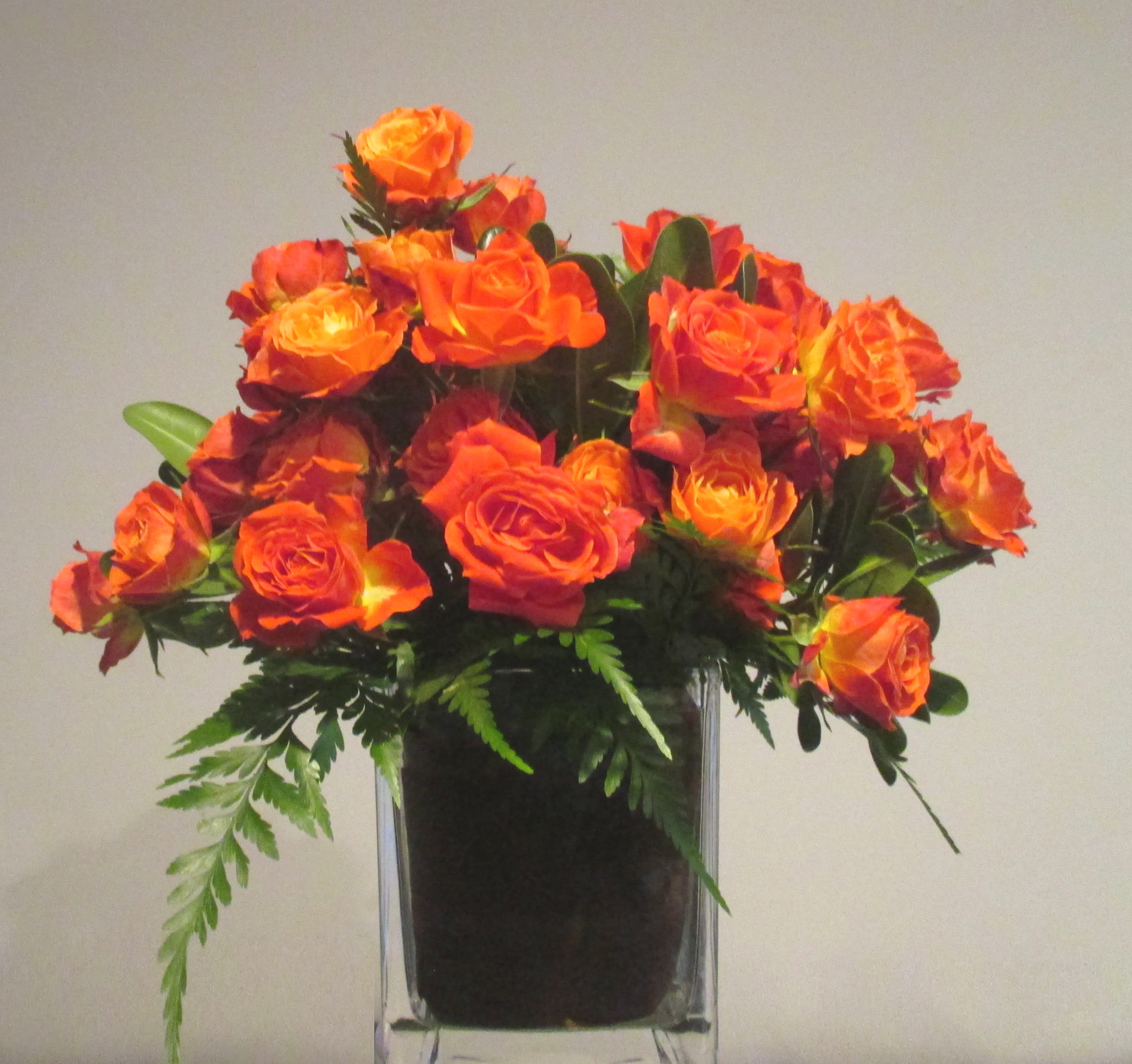 Keepsake Keepsake - Simply beautiful. Remind your sweetheart how much you love them with this memorable piece. This bright and cheery arrangement will make them smile! A giant bunch of spray roses in a leaf wrapped square vase. Delivered as shown. You may request to change the color of the roses. Please do so in the special instruction box. Subject to availability and current stock on hand.