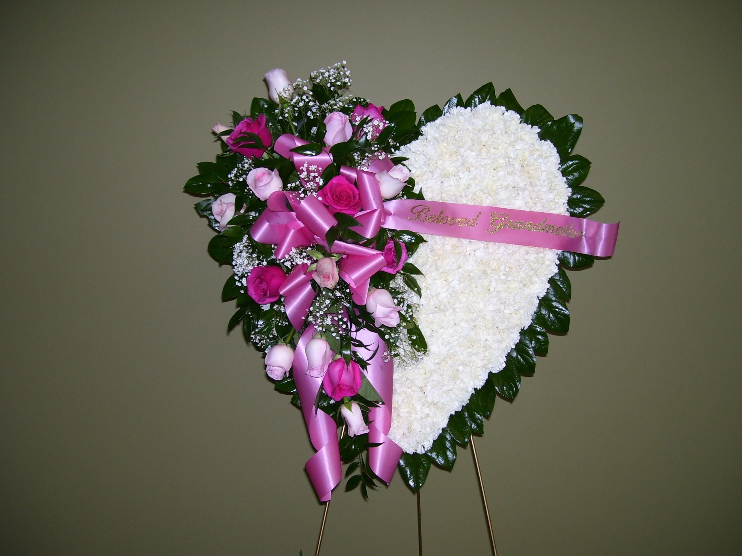 BROKEN HEART - PINK ROSES - APPROXIMATELY 24&quot; HEART OF WHITE CARNATIONS WITH A PINK ROSE CLUSTER ON AN EASEL