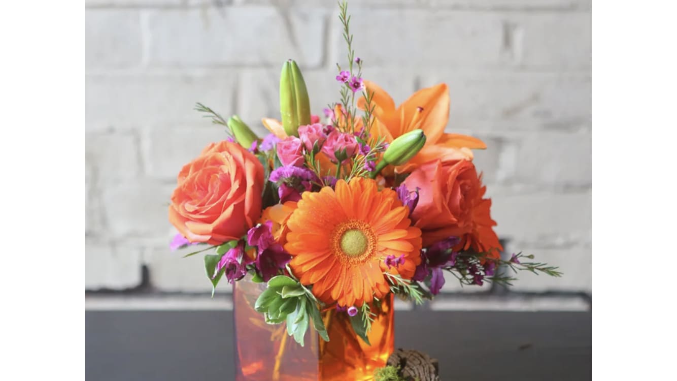 Orange Contentment - Spread the contentment with orange lilies, orange roses, and orange Gerbera daisies.