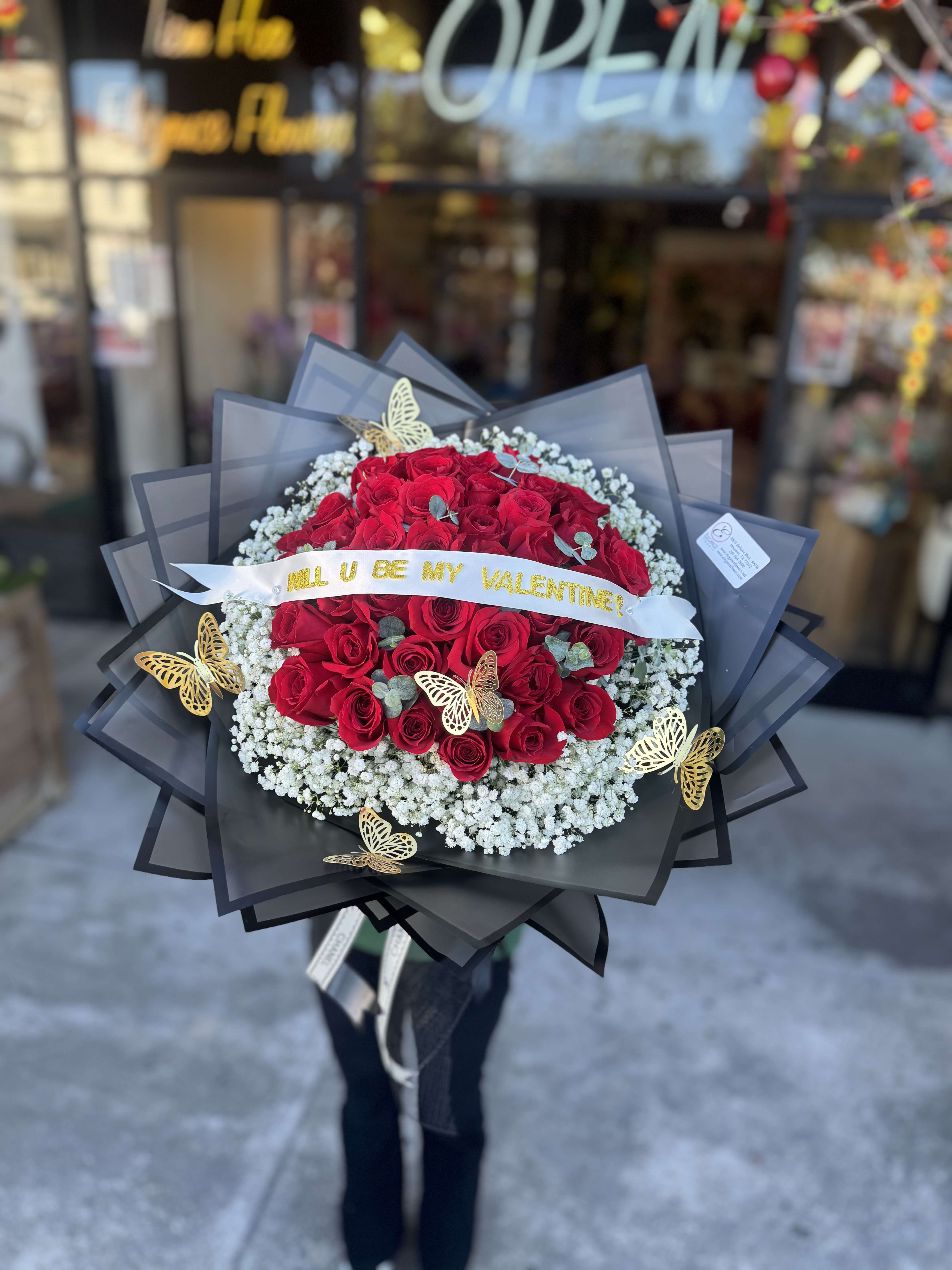 Wrapped Bouquet #23 Wrapped Bouquet #23 - *Please included changes if needed for the banner message at checkout or call us* Thank You ! A wrapped bouquet of flowers is a beautifully arranged collection of blooms, carefully selected and elegantly wrapped in decorative paper or fabric. These wrapped bouquets are perfect for any occasion, from expressing love and gratitude to celebrating special moments, offering a thoughtful and visually stunning gift.