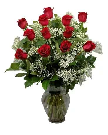 Classic Elegance Dozen Classic Elegance Dozen - Classic Dozen Red Roses Express love, admiration, and appreciation with this timeless dozen red roses arrangement. Handcrafted with fresh, high-quality blooms, this elegant bouquet is beautifully accented with lush greenery and delicate baby’s breath, all arranged in a stylish glass vase. Some color modifications can be made. Please let us know in the " special Instructions" section if you would like to change up the colors and we will do our best to modify if possible. What’s Included? 12 Premium Red Roses – Fresh, long-stemmed roses carefully arranged for a luxurious look. Lush Greenery & Baby’s Breath – Adds a soft, romantic touch. Elegant Glass Vase – A keepsake vase to enhance the beauty of the arrangement. Perfect For: Valentine’s Day Birthdays Anniversaries Sympathy & Condolences Just Because