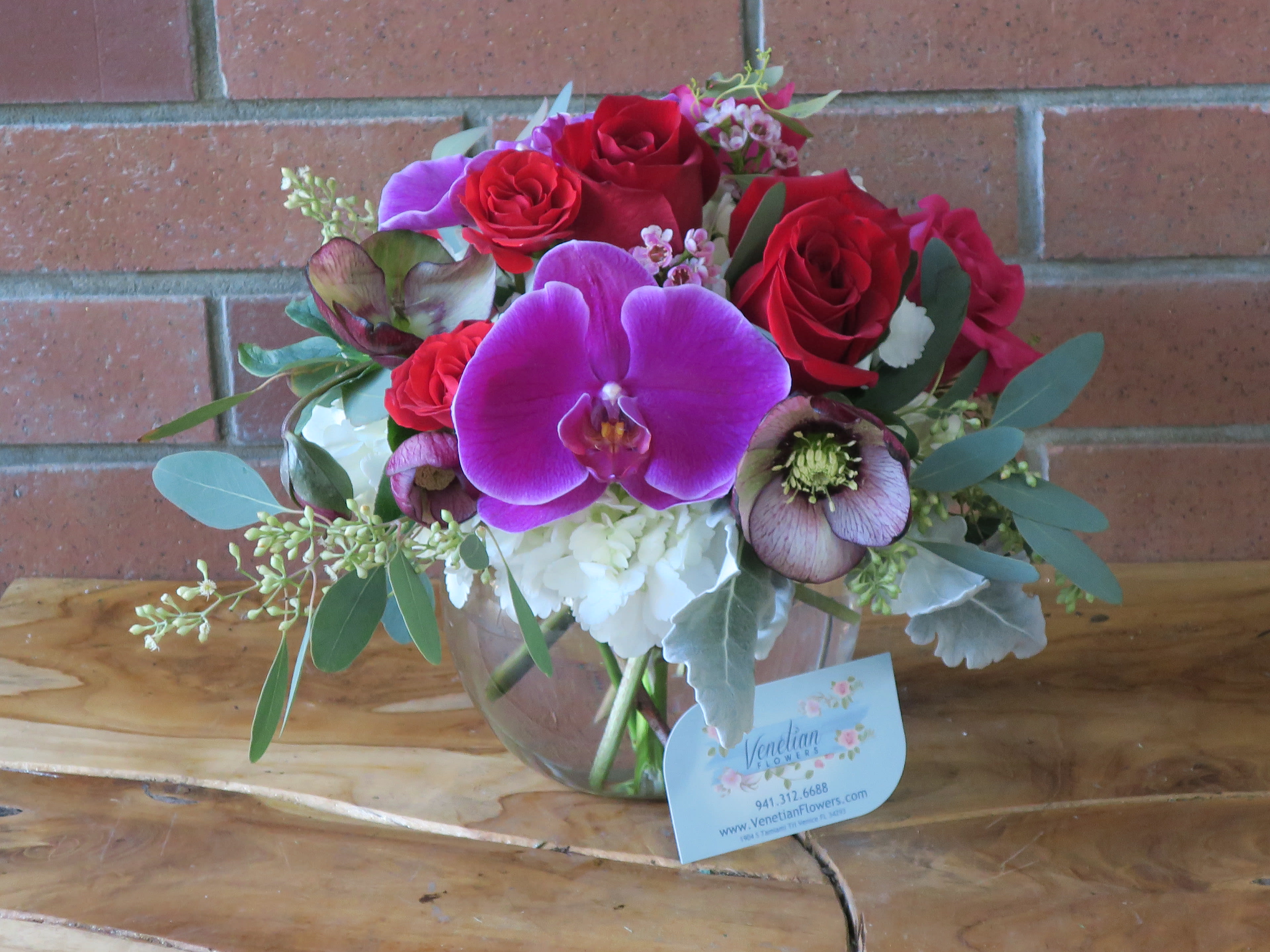 Heart Melt Bouquet - An arrangement that will make her heart melt! Top quality purple orchids, red and pink roses, helleborus, seeded eucalyptus and white hydrangea, oh so romantic~ Standard as pictured  Deluxe &amp; Premium upgraded 