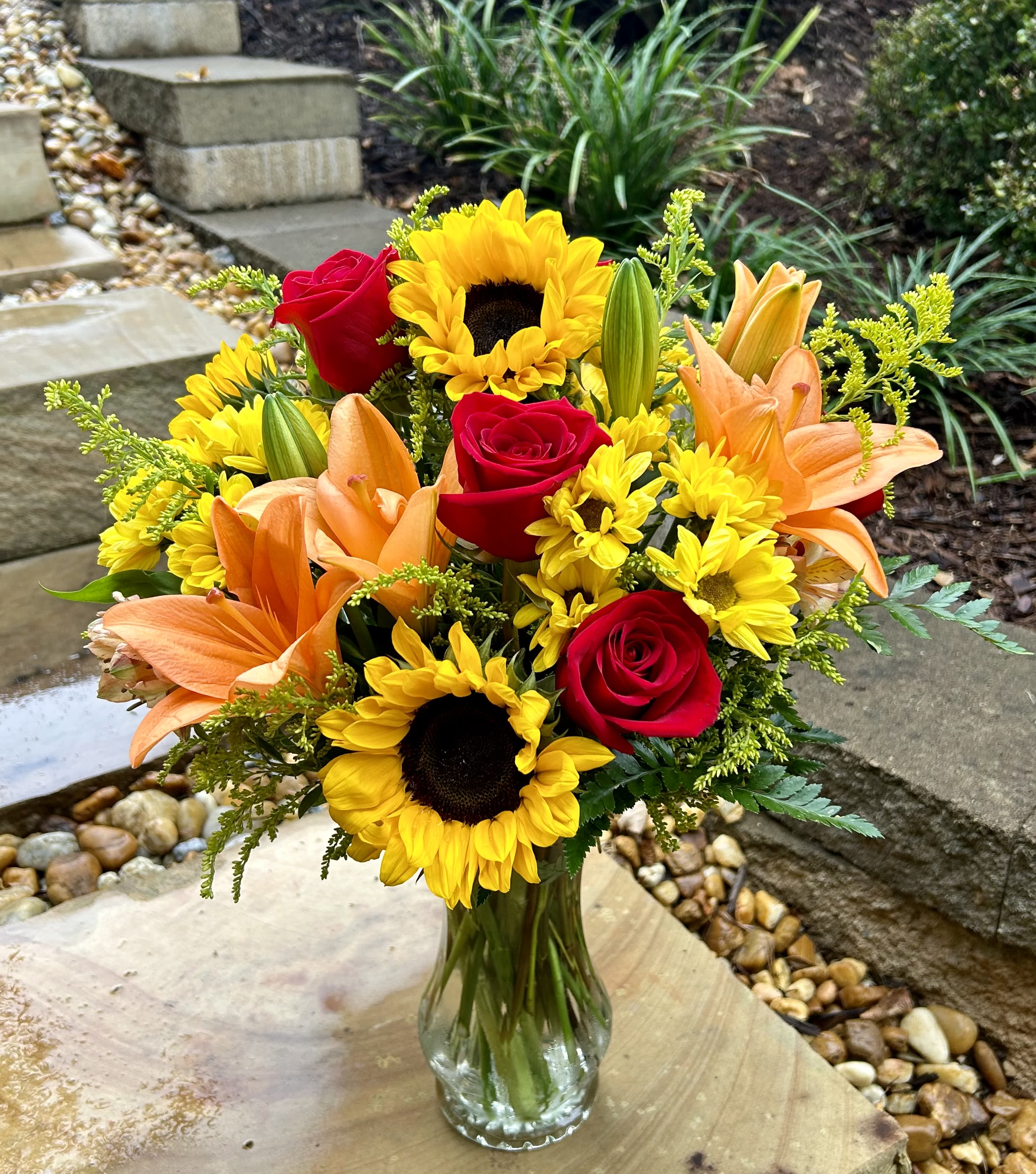 Happy Harvest - A beautiful fall arrangement with sunflowers, roses, lilies and other filler flowers to make someone’s day! 