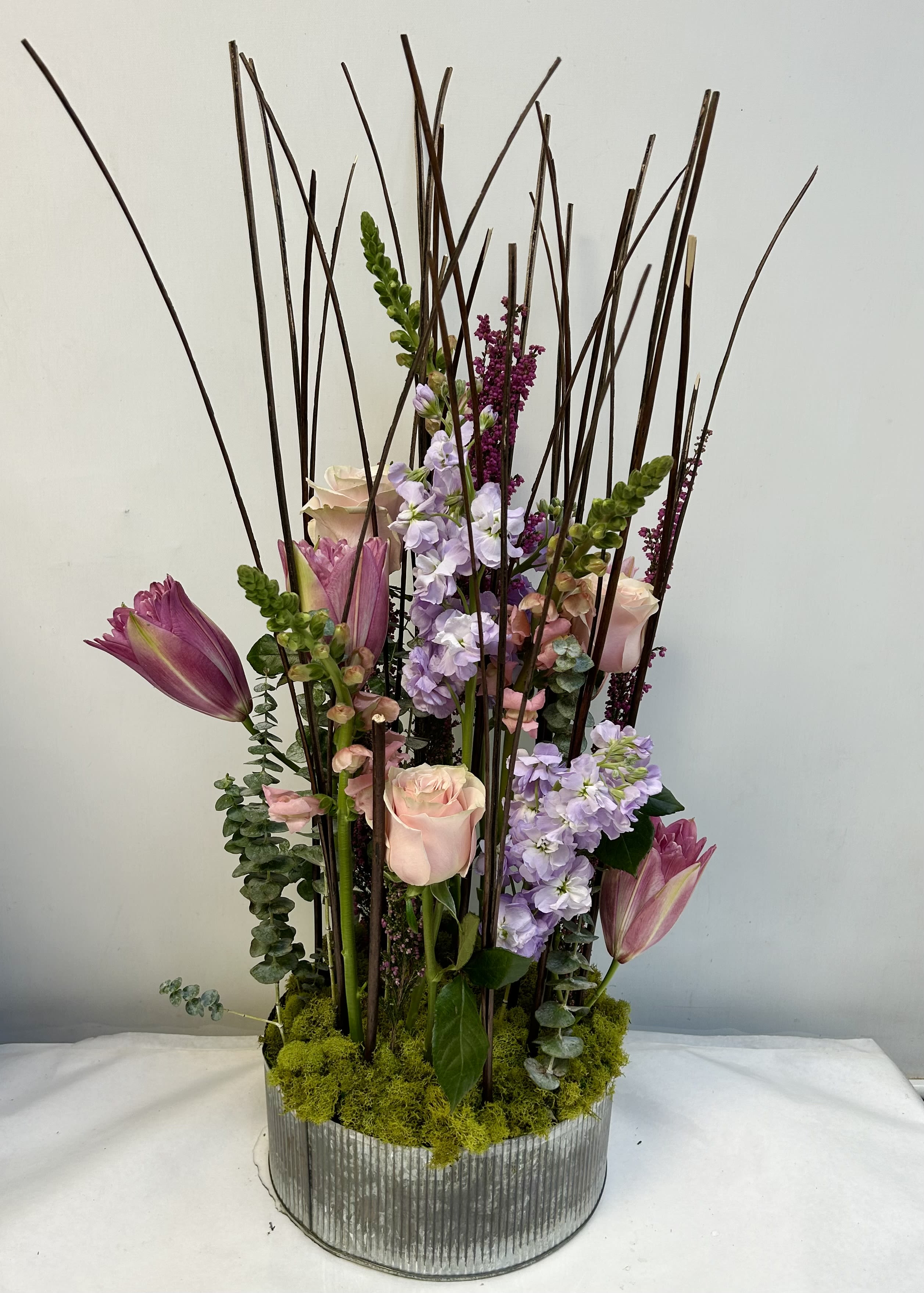 Spring Garden - A modern design, including stock, roses, lilies and so much more! Impress someone with this unique design!