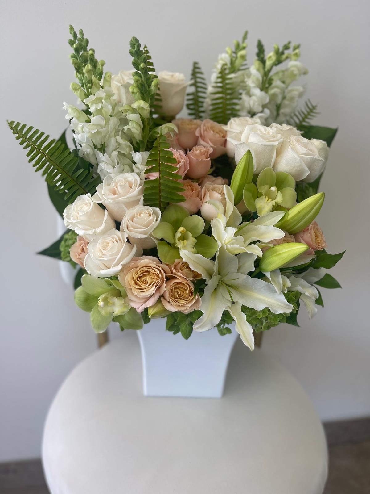 Peach  - Designer arrangement roses, lilies, and spray roses. 