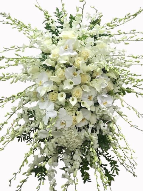 Sympathy Spray Sympathy Spray - A lovely and ornate funeral spray of flowers, presented on a freestanding easel, a beautiful and touching tribute