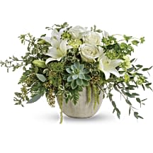 Flourishing Beauty  - Bring flourishing beauty to any occasion with this naturally elegant arrangement of fresh white flowers, fresh succulents and delicate greens. The wildly chic arrangement is presented to perfection in a charming weathered pot.  Orientation All-Around  Dimensions 20 3/4 W x 13 H