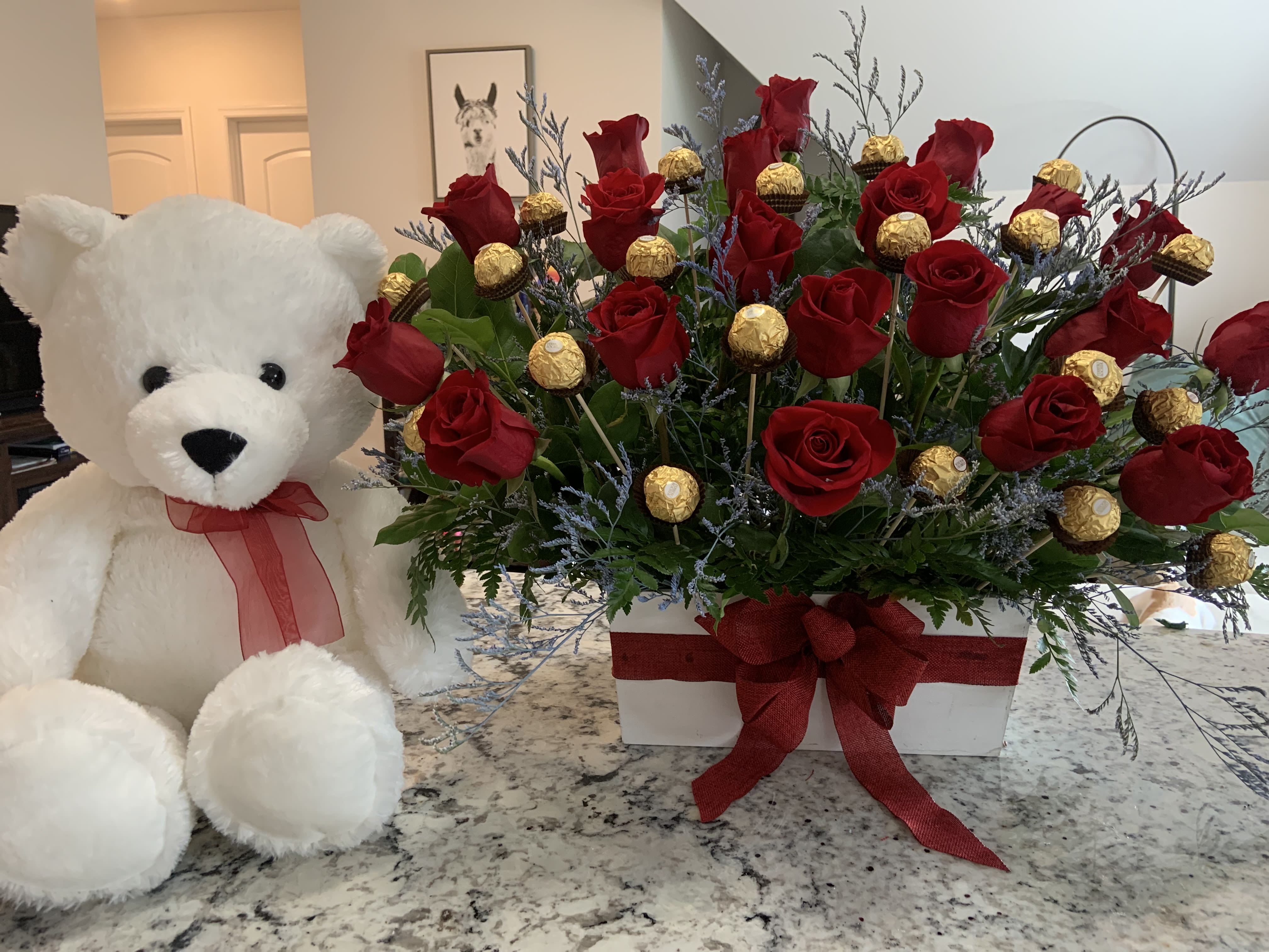 Sweet love  -  A luxurious floral box featuring stunning red roses paired with delicious Ferrero Rocher chocolates, creating the perfect balance of romance and sweetness. Ideal for Valentine’s Day, anniversaries, or simply to say “I love you” in the most special way.