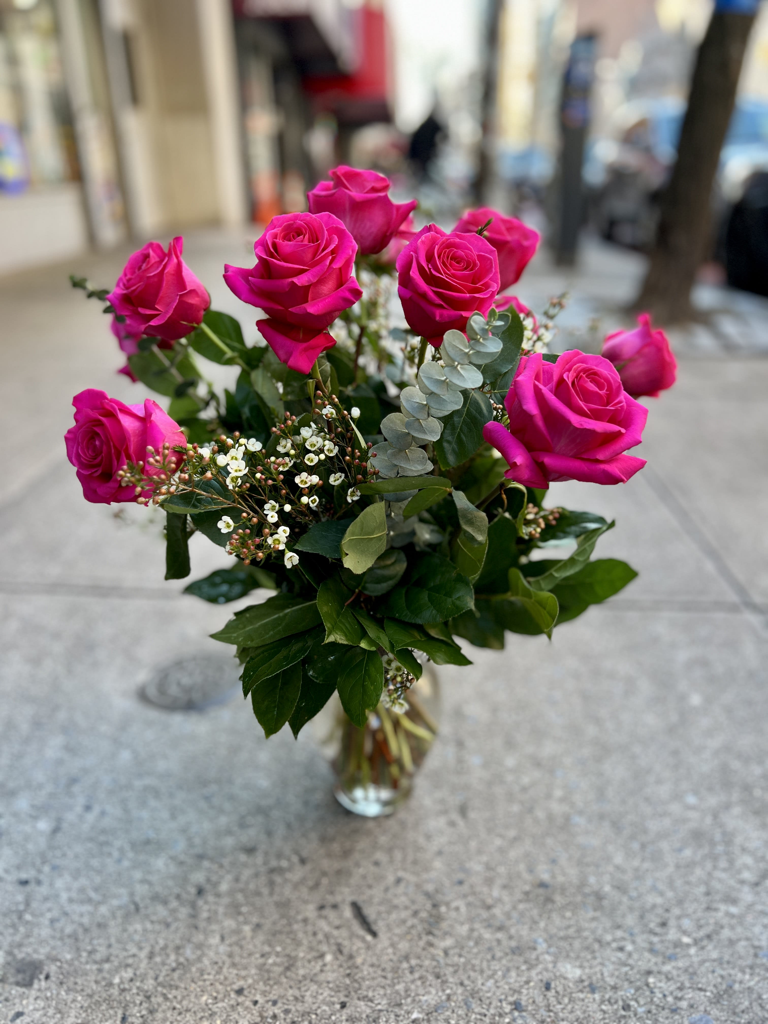 One Dozen Pink Floyd Roses One Dozen Pink Floyd Roses - CLASSIC ROSES BY THE DOZEN! DESIGNED IN A TALL VASE TO SHOW OFF THE LONG STEMS OF A CLASSIC “LONG STEM ROSE” ARRANGEMENT. WE USE GREENERY AND SOME PETITE FILLER FLOWERS OR BRANCHES TO GIVE YOUR ROSES EXTRA VOLUME THAT MAKE A HUGE IMPACT.If your special someone isn't a fan of red roses brighten their day with these stunning Pink Floyd roses! These hot pink roses are sure to make your loved one feel bright and happy on their special day!