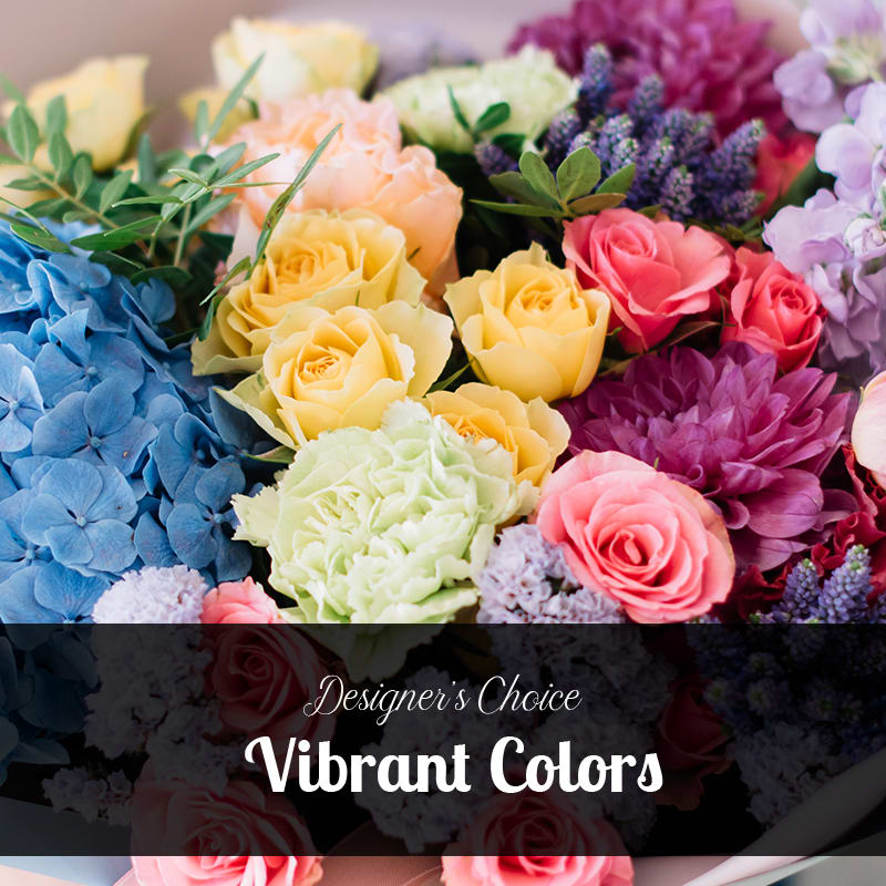 Designer's Choice - Vibrant Colors - Designer's Choice - Vibrant Colors  Let us create a beautiful arrangement of fresh cut flowers perfect for your occasion. Bright vibrant colors of in season flowers.  Arrangements will all very to what manly flowers we have in stock. The cover photo is a stock photo and holds no sway on what will be in the arrangement. This is a designer's CHOICE and will be a beautiful arrangement of fresh flowers. To place order with certain flowers please call us! We will be glad to help any way we can!