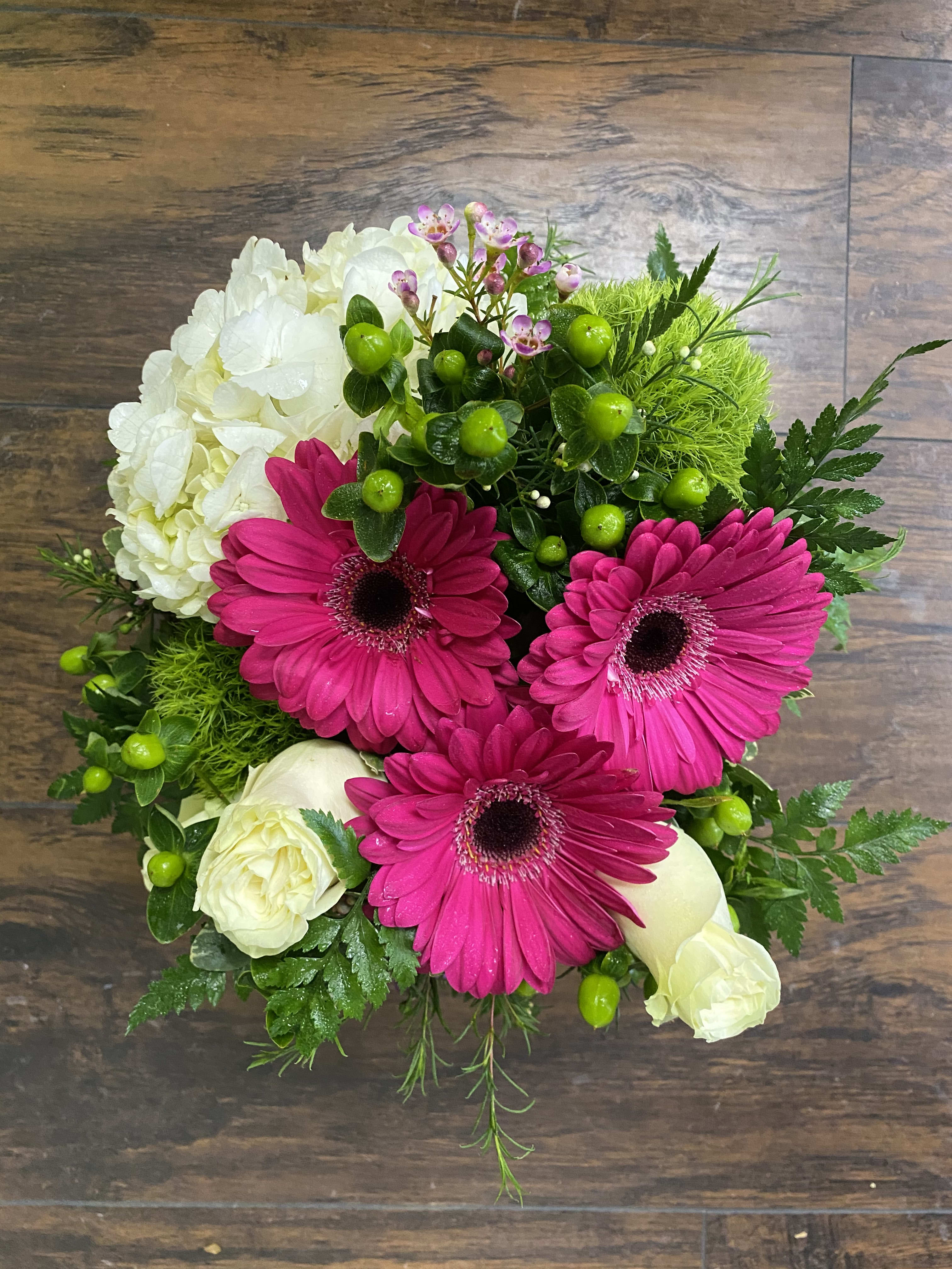Box of Love - A beautiful &quot;farm style&quot; whitewashed box filled with a colorful mix of hydrangea, gerbera daisies, roses, green balls, and hypericum. Your valentine will just adore this sweet and special arrangement. 
