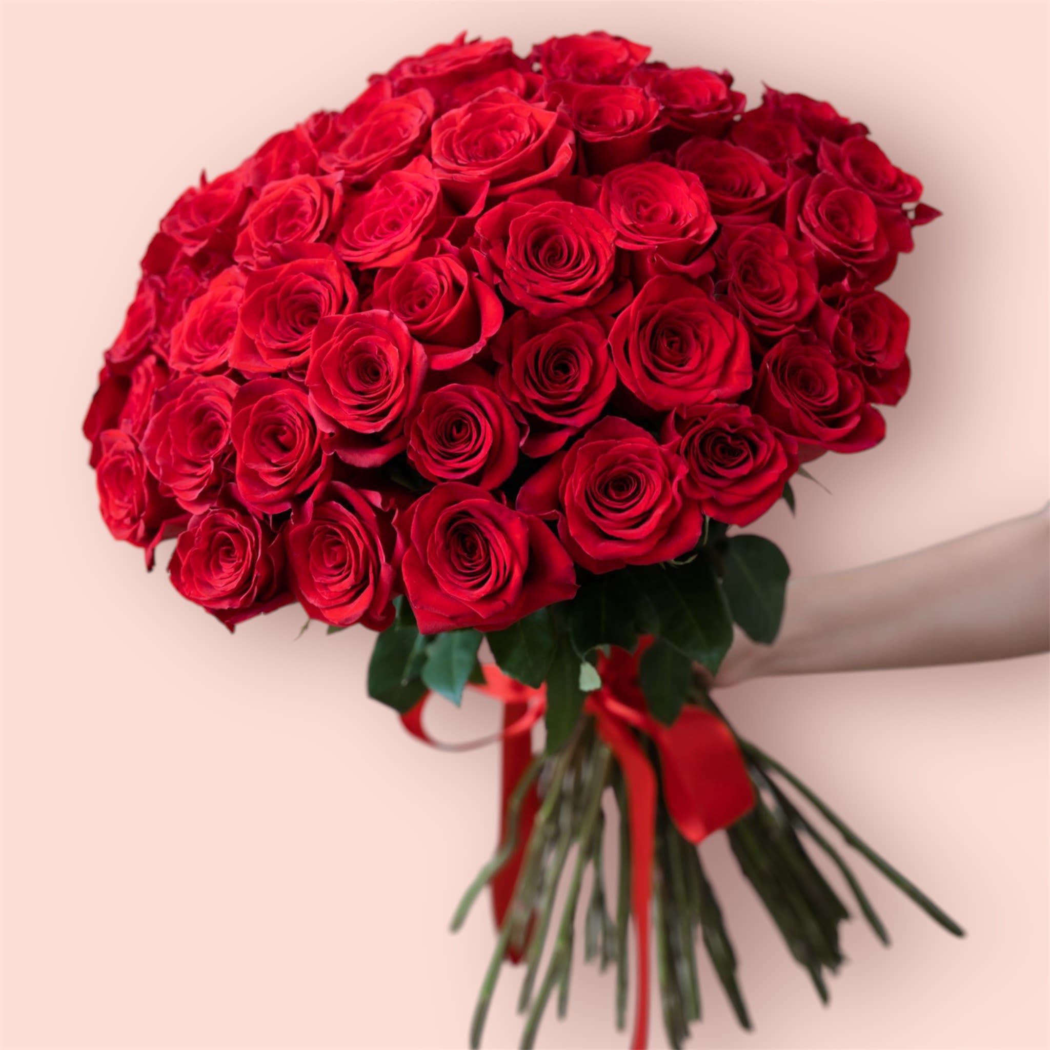 50 Long Stem Red Roses 50 Long Stem Red Roses - Impress your loved one with this stunning hand wrapped bouquet of 50 fresh roses! Bouquet is delivered with a tall cylinder keepsake vase.