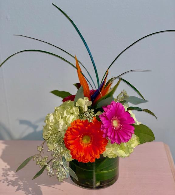 A Little Slice of Paradise A Little Slice of Paradise - This pave'd vase arrangement is bright and beautiful with a bird of paradise flower in it's center.