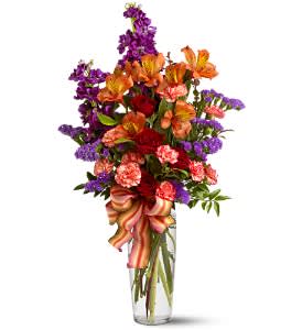  Fall Fragrance  - Reach for the sky with this fragrant and colorful mix of roses, carnations and mixed blooms that's almost two feet tall! A showy, striped satin ribbon adorns this pretty, well-priced bouquet that's sure to impress. For a birthday, congratulations or just because.  Red spray roses, orange miniature carnations and alstroemeria, purple stock and sinuata statice, and huckleberry are delivered in a clear glass vase adorned with a striped satin ribbon.  Approximately 12&quot; (W) x 23&quot; (H)  Orientation: All-Around      As Shown : TFWEB231  