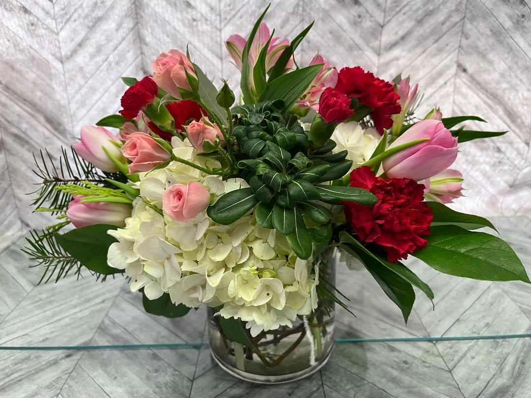 Lullaby Bouquet Lullaby Bouquet - White Hydranga, pink tulips, red mini carns in a 5by5 cylinder