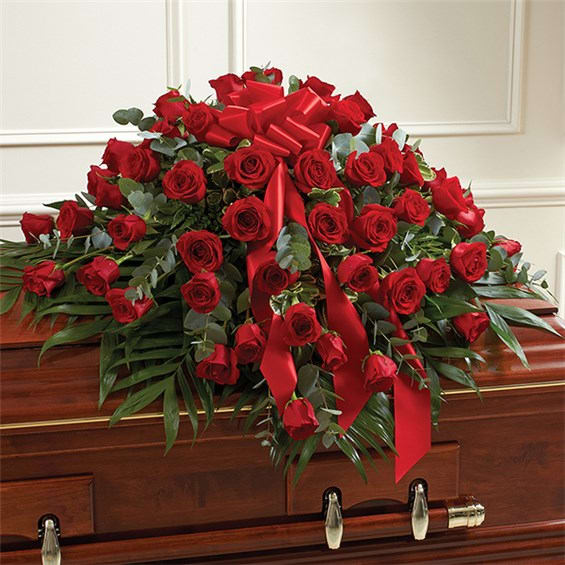 Red Rose Half Casket Cover - Reflect on a life well lived and loved with this beautiful red casket spray. Features gorgeous long stem red roses and vibrant greenery Traditionally sent by the immediate family to the funeral home Our florists use only the freshest flowers available, so colors and varieties may vary Arrangement measures approximately 16H x 28W x 38L 