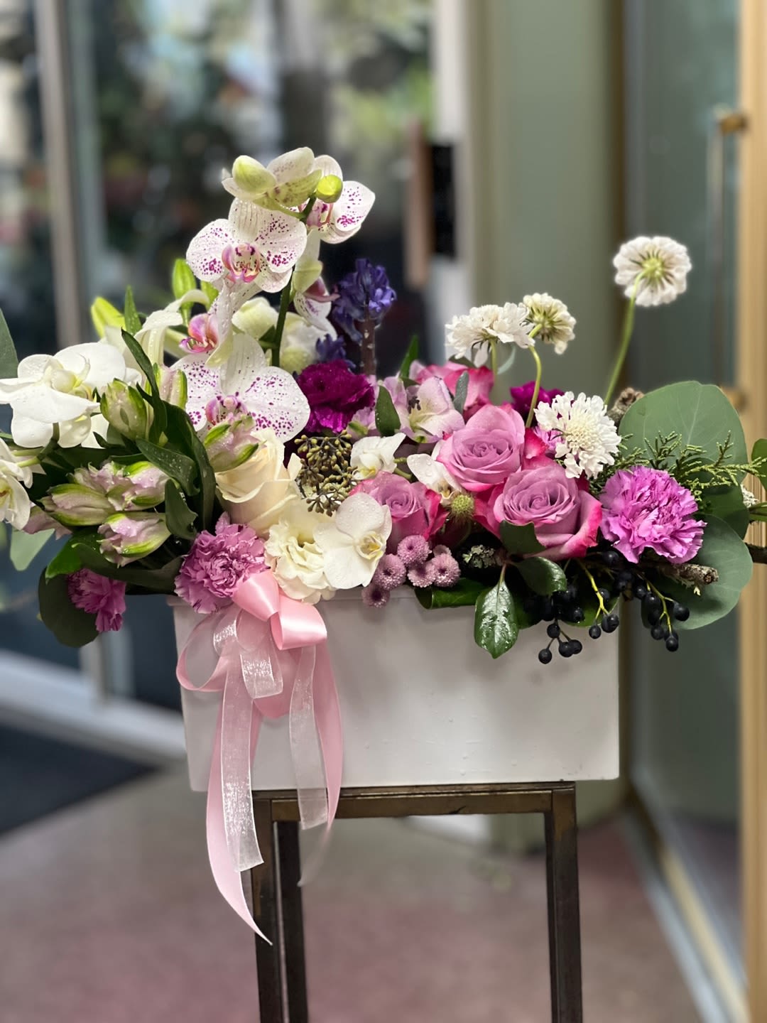 Song of Flowers by Charlene Song of Flowers by Charlene - Stunning arrangement, including Phalaenopsis, orchid, and Scabiosa and imported roses. Perfect gift for birthday and celebrations events.