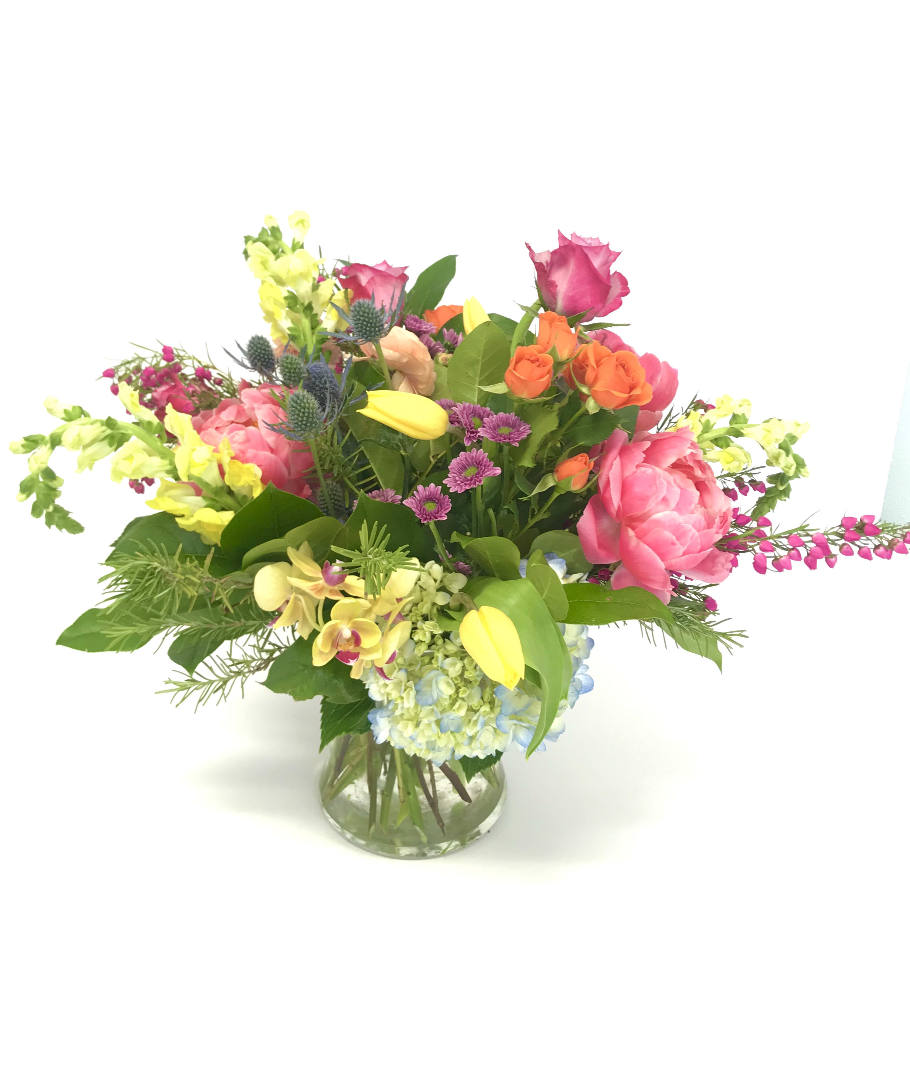 The Alabama  - A custom designed arrangement by Fairbanks Florist. A beautiful collection of mixed seasonal flowers that are fresh in our shop the day of delivery. We try our best to design something similar to what is pictured, but our shop does custom design - so each arrangement is a little different, but has the same spirit, beauty and freshness.  Your arrangement will be designed in the style shown but flowers and containers may be different from that pictured. Our designers make every effort to use the best floral selection of the day.