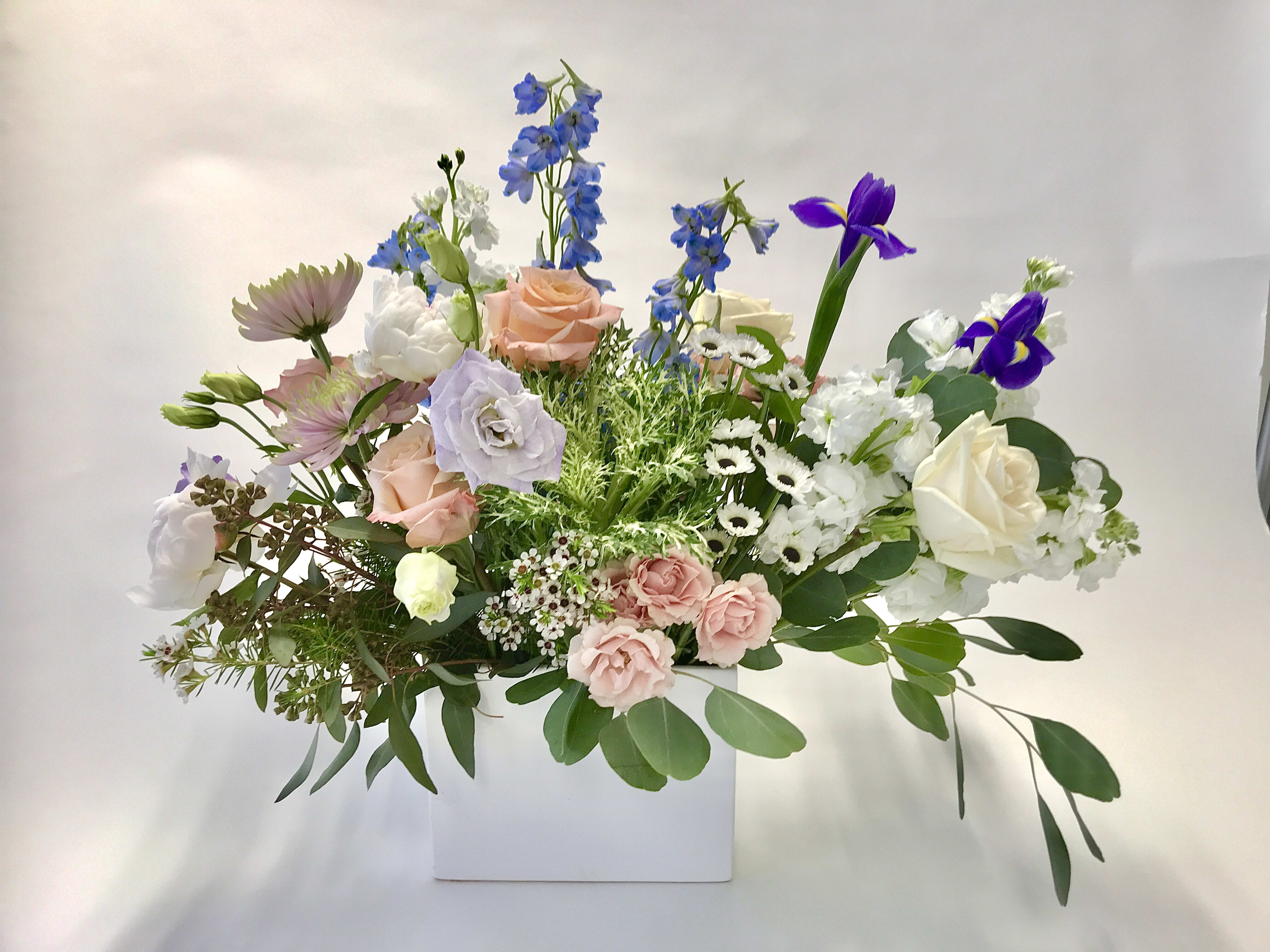 The Hollieana  - A custom designed arrangement by Fairbanks Florist. This bouquet is filled with the best of spring!  Flowers in this color pallet are fresh in our shop the day of delivery. We try our best to design something similar to what is pictured, but our shop does custom design - so each arrangement is a little different, but has the same spirit, beauty and freshness.