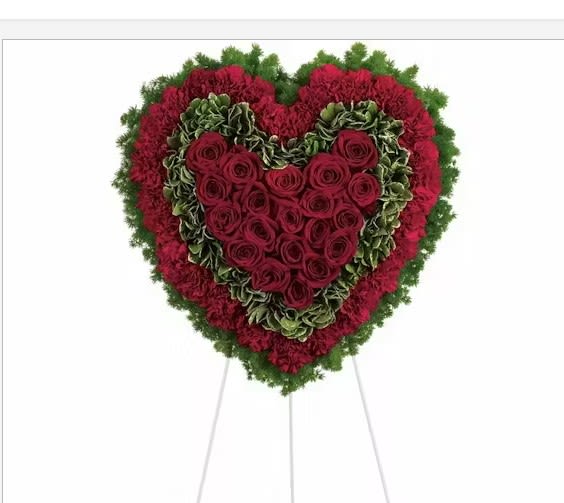 Majestic Heart - Remember a loved one's generous heart with this red arrangement in a classic heart shape, a declaration of eternal love and devotion. Standard size 18&quot; diameter form used. Deluxe size 24&quot; diameter form used.