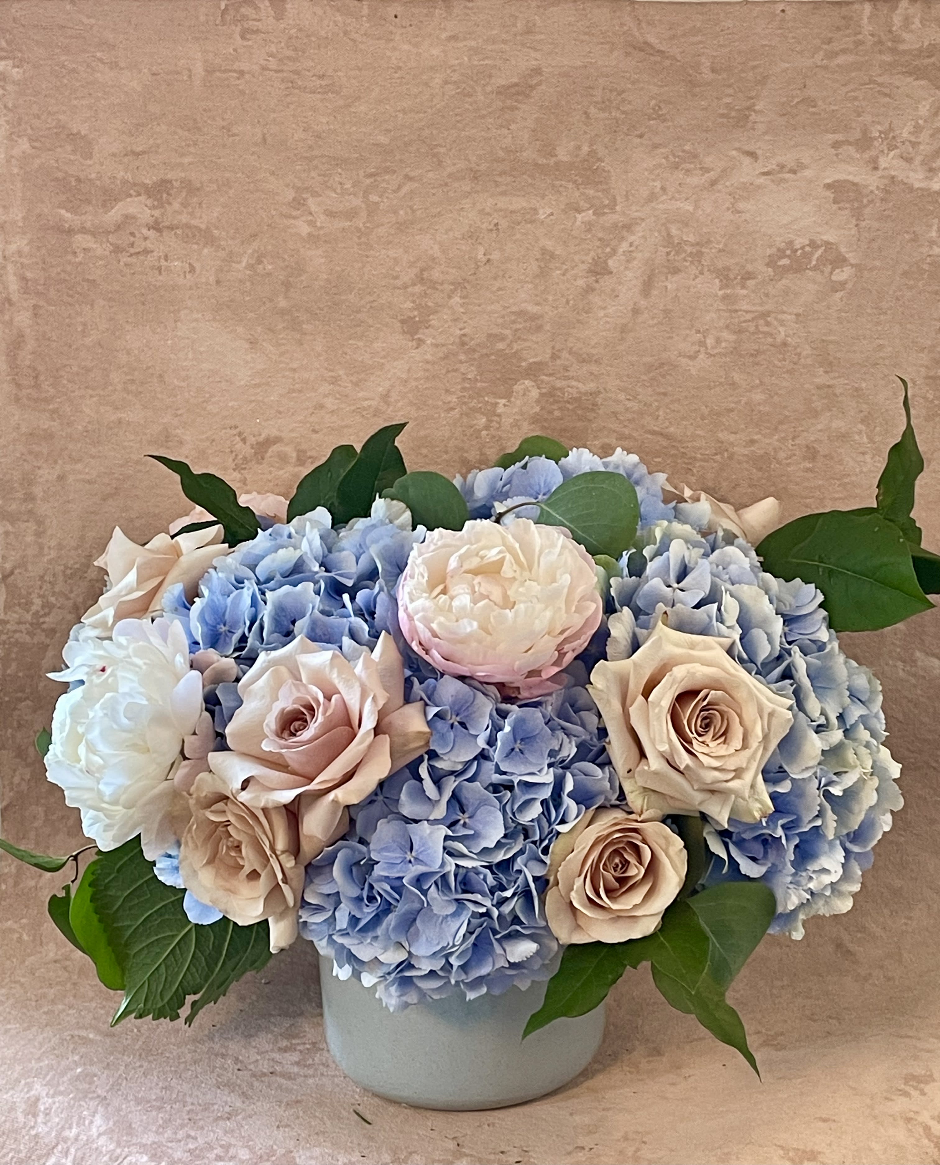 The ACK - We brought the classic Nantucket vibes back to the shop with us. Our classic Big Basic B but with a pop of color featuring these gorgeous blue Dutch Hydrangea.