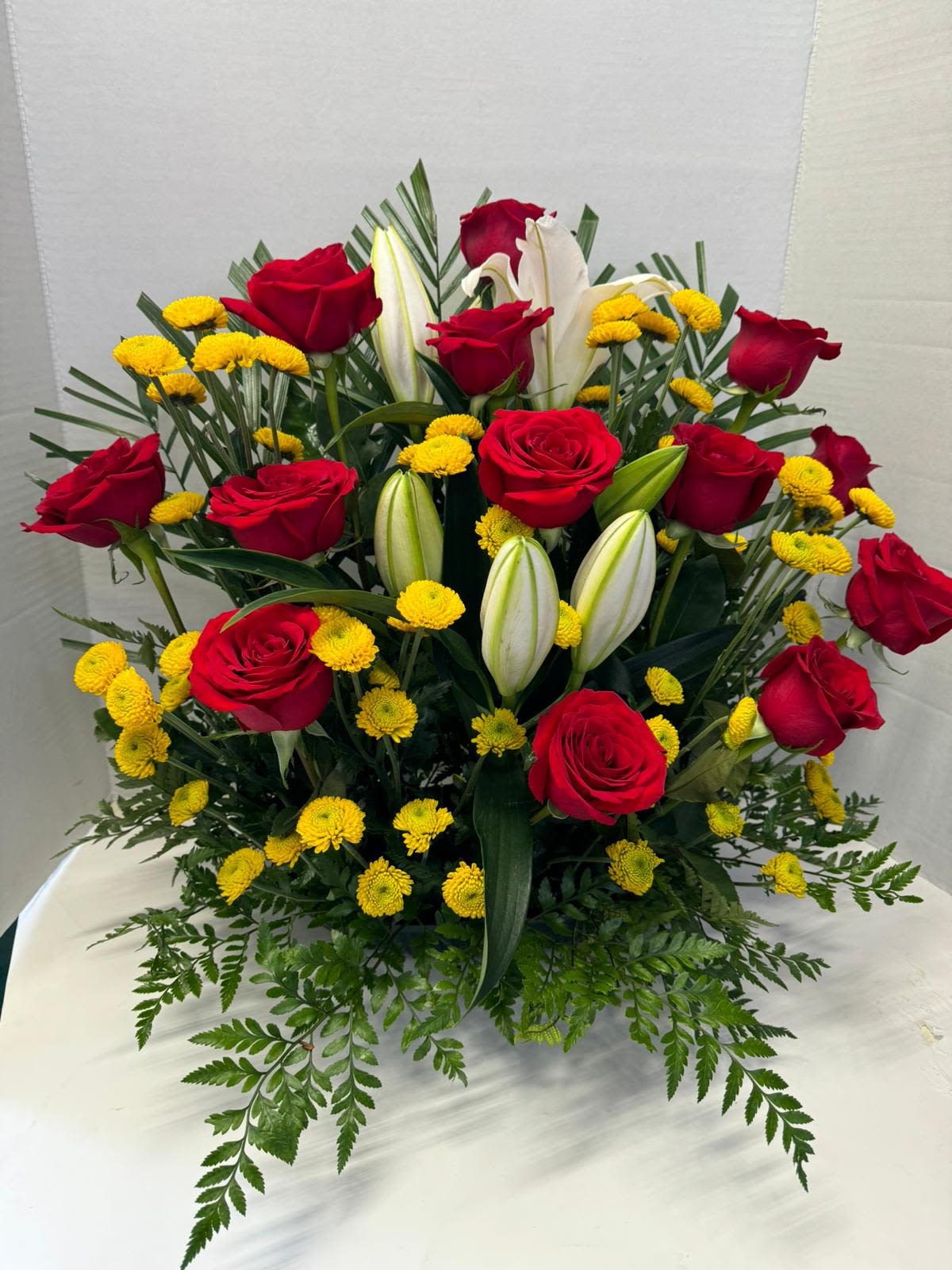 lilies and roses arrangement - An arrangement with lilies and 18 roses simply the best for anyone