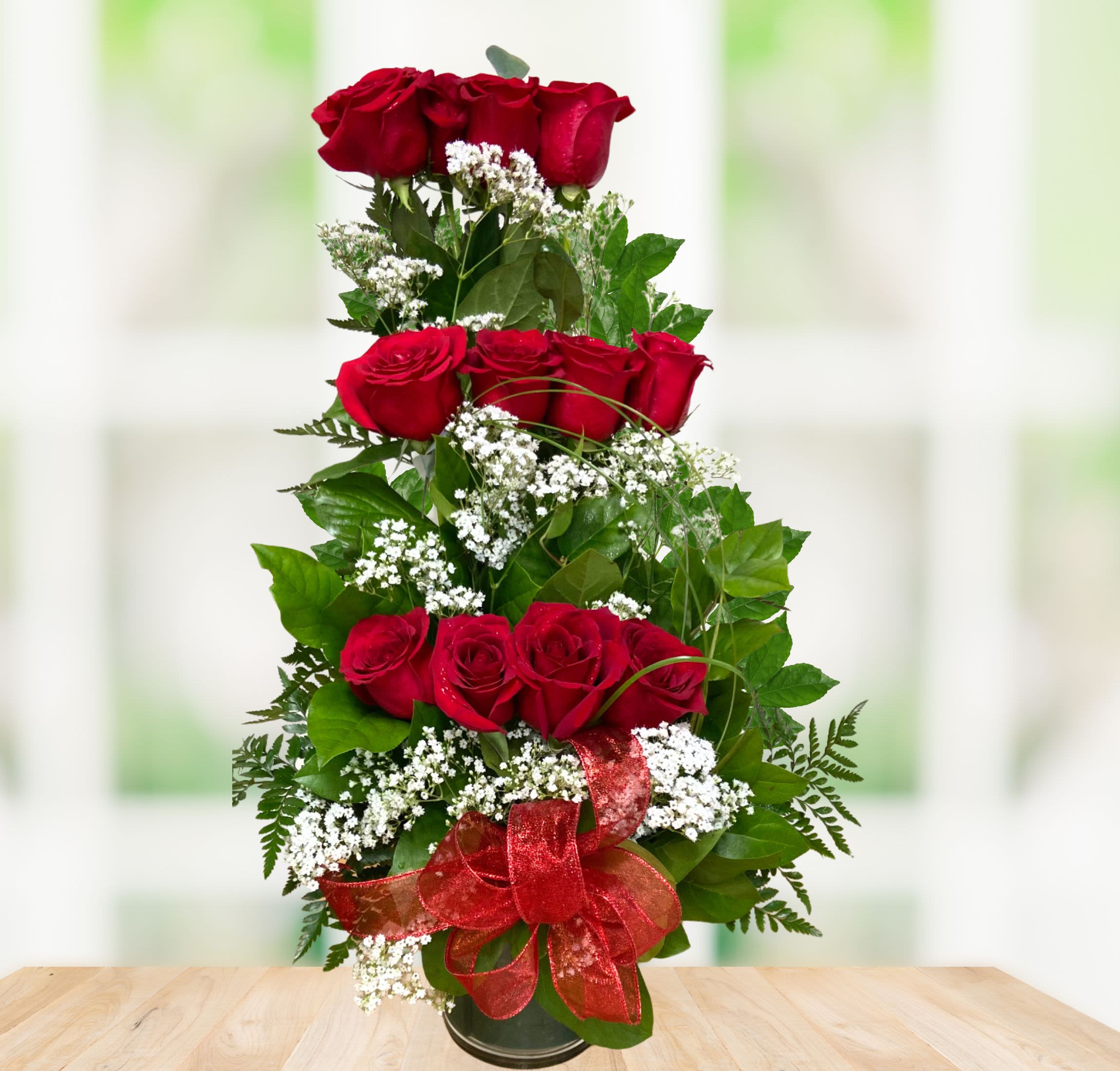 Red Ruby Beauty Red Ruby Beauty - This Beautiful tower of Roses is designed with 12 big beautiful Red Roses with greenery, baby's breath elegant bow in a glass vase. Perfect for any special occassion!