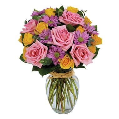 Spring Brilliance Bouquet - Roses and daisies in several colors form the focal points of a pretty sympathy arrangement artfully crafted together in an elegantly shaped vase. A natural raffia tie adds to an overall look of graceful beauty. Small measures 14?H X 10?L. Medium measures 15?H X 11?L. Large measures 16?H X 12?L.
