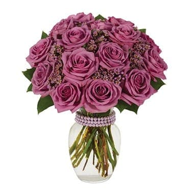 Purple Rose Bouquet Purple Rose Bouquet - Different, yes. Impossible to resist, absolutely! The emphasis is on vivacious color...in this memorable bouquet of purple roses and purple waxflower in a clear garden vase with a lavender bracelet. Small Measures 14"H by 11"L, Medium Measures 15"H by 12"L, Large Measures 16"H by 13"L.