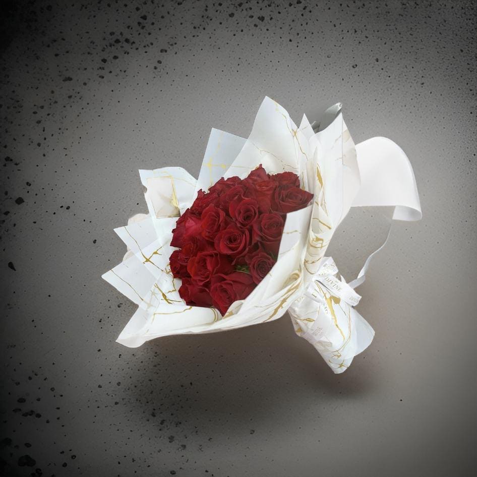 Hermosa - A bouquet of red roses wrapped in a Korea paper good  for that special occacion   (You can change the color of the paper or choose another color of flowe