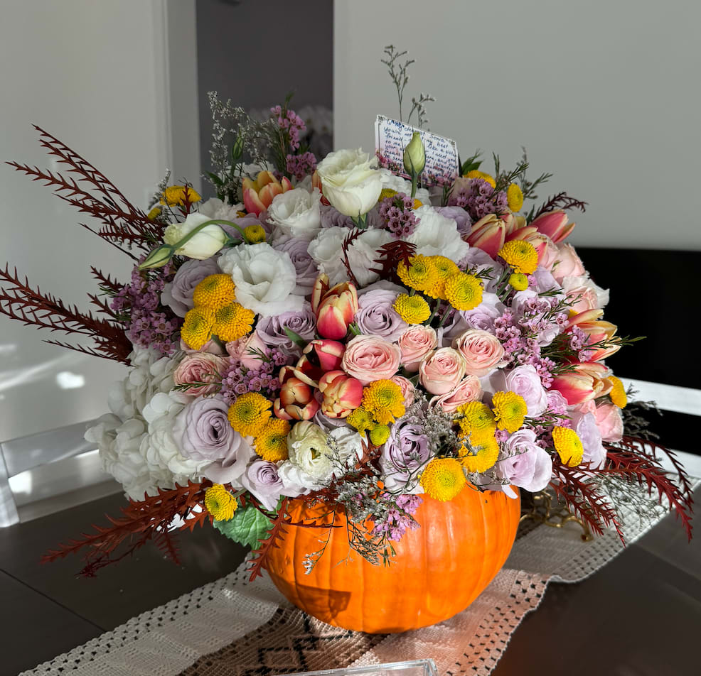 Harvest hues Harvest hues - Brighten your autumn celebrations with our Limited Edition Fall Pumpkin Floral Arrangement! Bursting with vibrant seasonal blooms, this stunning display is artfully arranged in a fresh pumpkin, creating a unique centerpiece that captures the essence of fall. Perfect for gatherings or as a thoughtful gift, this arrangement adds warmth and charm to any space. Elevate your decor with this captivating piece that brings joy and seasonal spirit to your home or office. Don’t miss out—order your exclusive Fall Pumpkin Floral Arrangement today and let the beauty of autumn inspire you!