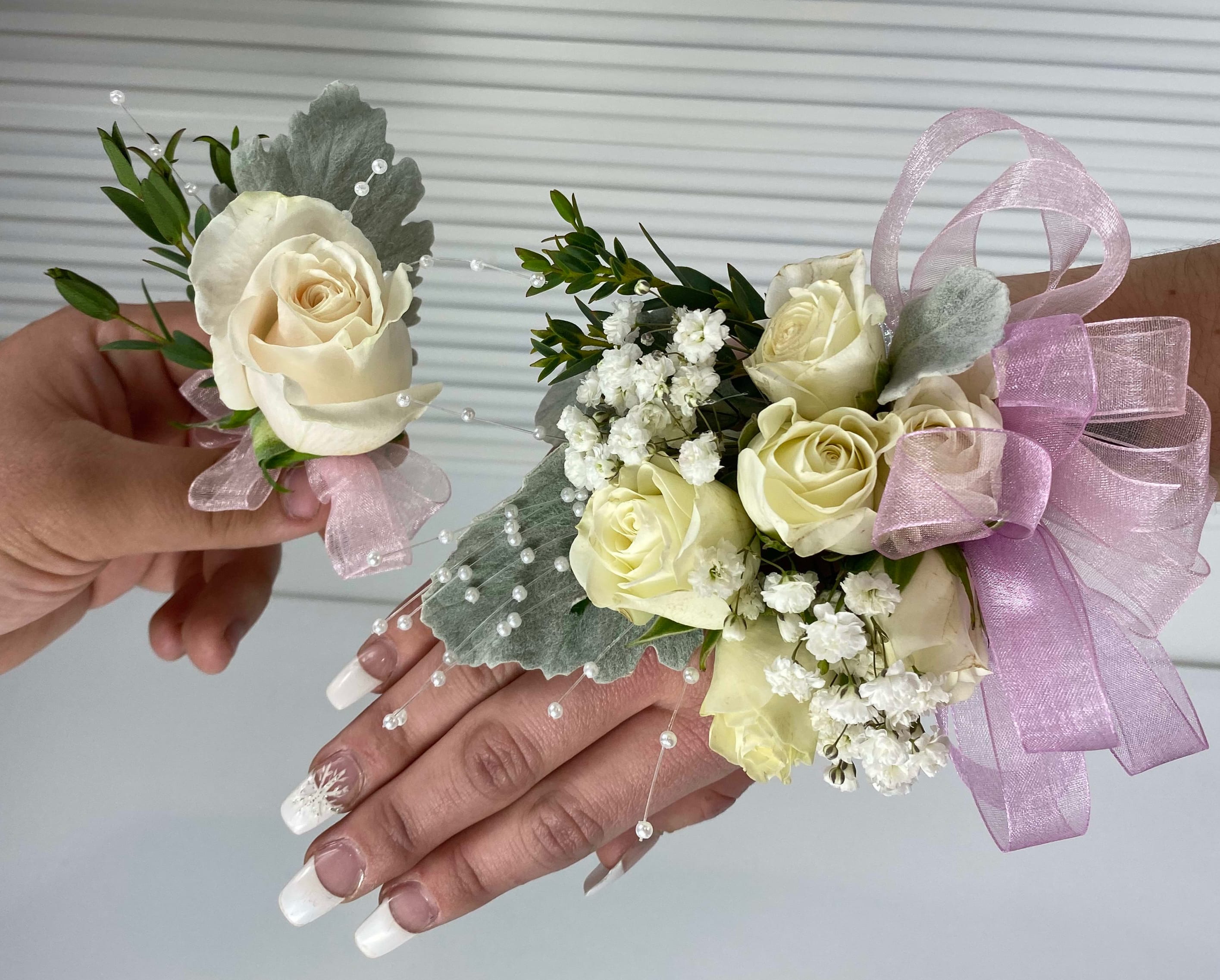 Corsages and Boutonnieres for High School Formals  - White Roses - White roses and embellishments with colored ribbon.  