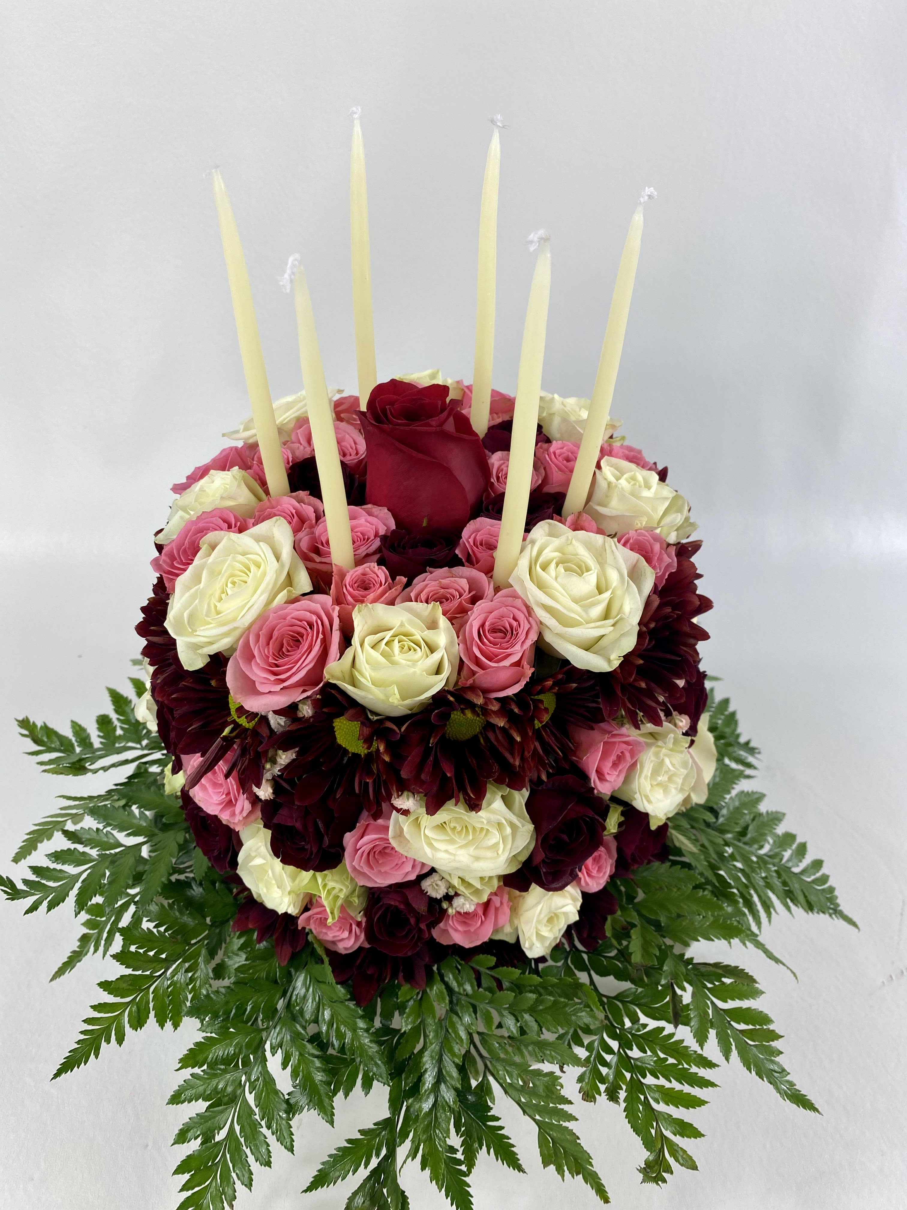 Deluxe Flower Cake - Rich flower cake on a stand contains pink and red spray roses and orange daisies. You can choose your colors.