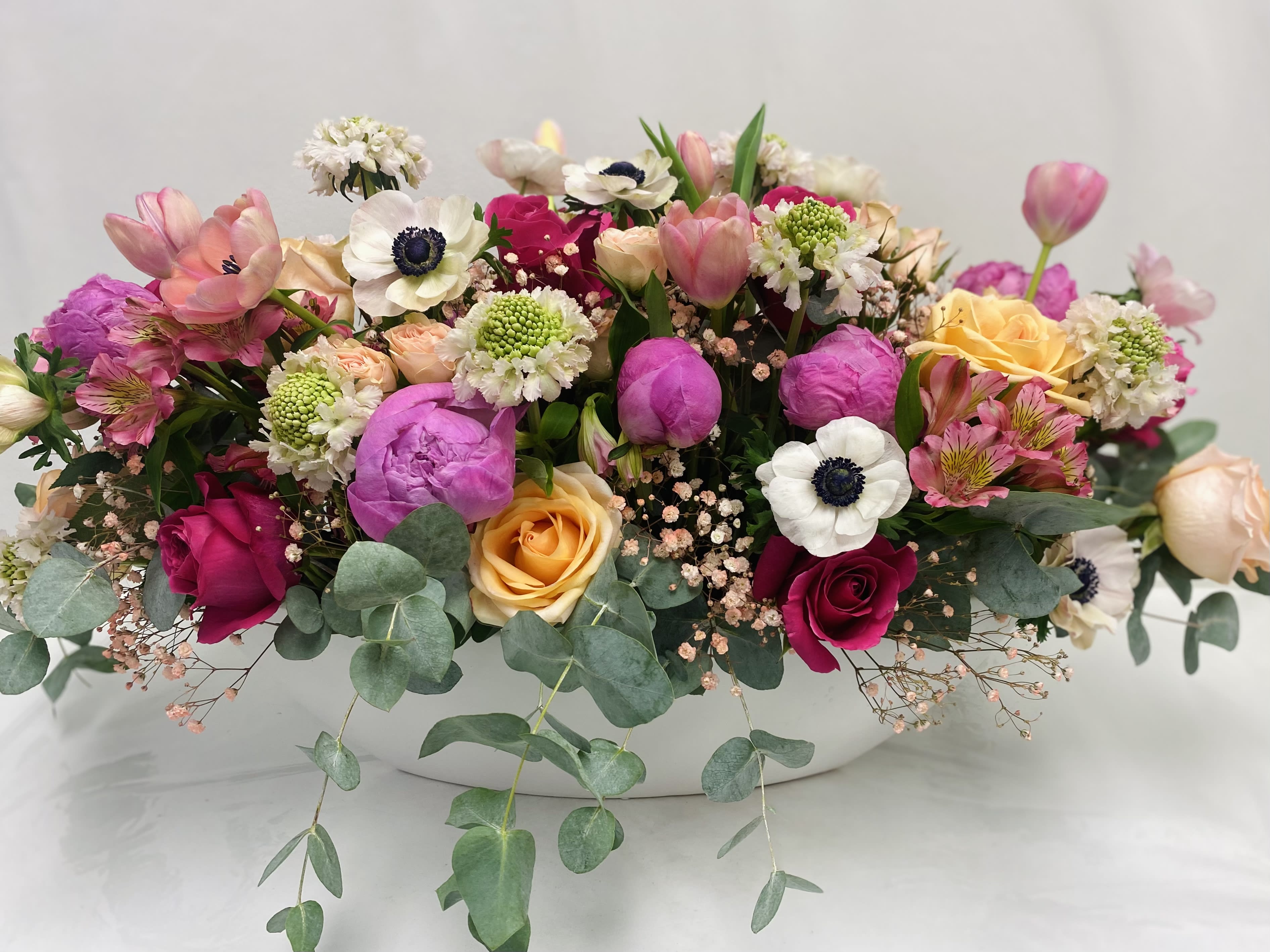 Love Boat - Very bright and pretty flowers in a boat shape vase.
