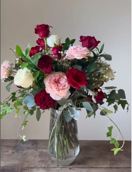 Roses on Parade Roses on Parade - A timeless display of elegance and romance. This contemporary classic arrangement features a stunning mix of red, pink, and white roses, artfully arranged with premium filler blooms and lush greenery. Perfect for celebrating love, anniversaries, or any occasion that calls for beauty and sophistication. Let this breathtaking bouquet make a lasting impression.