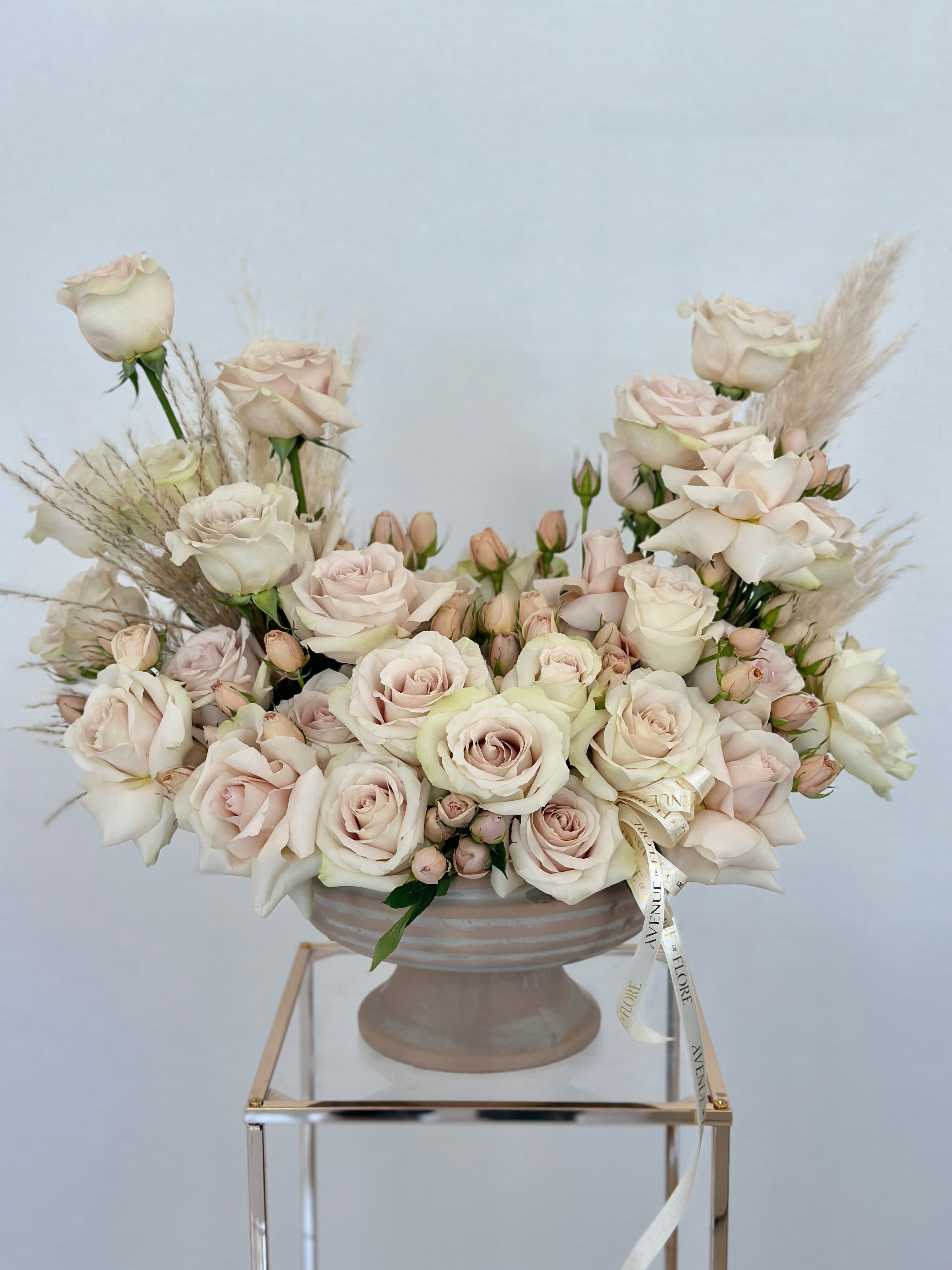 Neutral Delight - This casually elegant arrangement effortlessly blends into any space, making it an ideal present for anyone who appreciates the beauty of simplicity. With its soothing palette of neutral tones and its relaxed yet refined design, this arrangement adds a touch of understated charm to any room.  