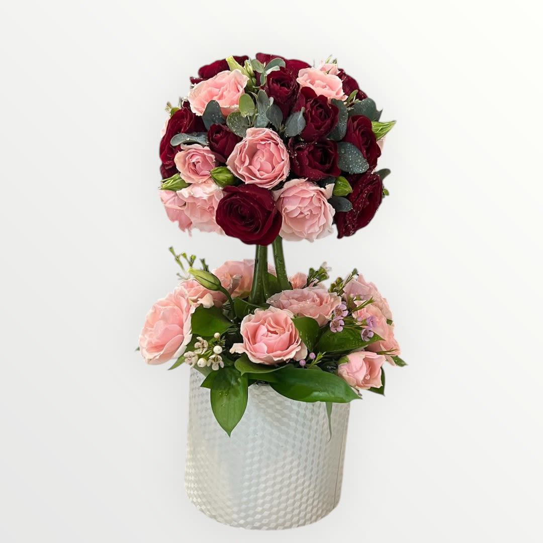Pretty Love Bouquet Pretty Love Bouquet - Keep 'em blushing with the prettiest pink and red spray roses, intricately sculpted into a dome shape resting on a bed of blush spray roses and lush greens.