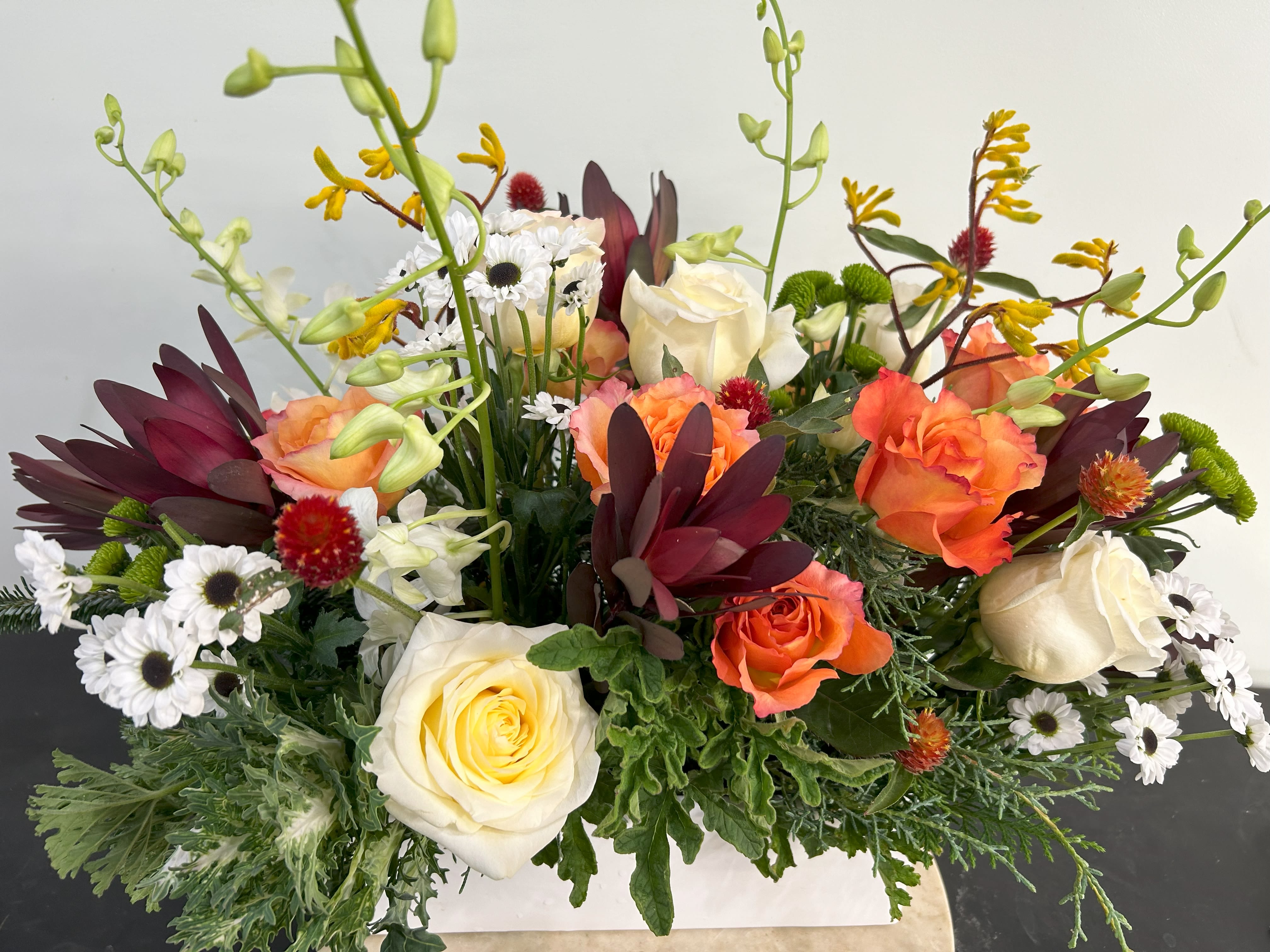 Centerpiece Rectangle - Perfect centerpiece for a holiday celebration or a special occasion using a 12 inch white rectangle ceramic vase. 