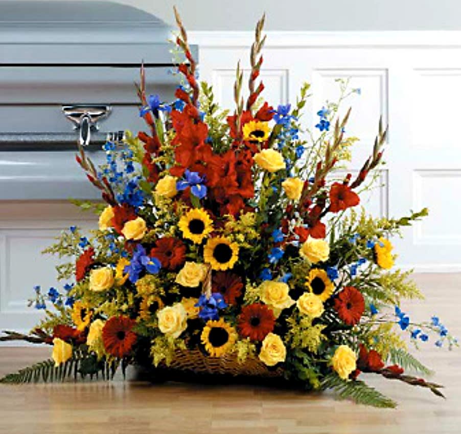 Triadic Fireside Basket in Red, Yellow and Blue Triadic Fireside Basket in Red, Yellow and Blue - Gerber Daisies, gladiola Iris, Delphinium, roses sunflowers and solidago