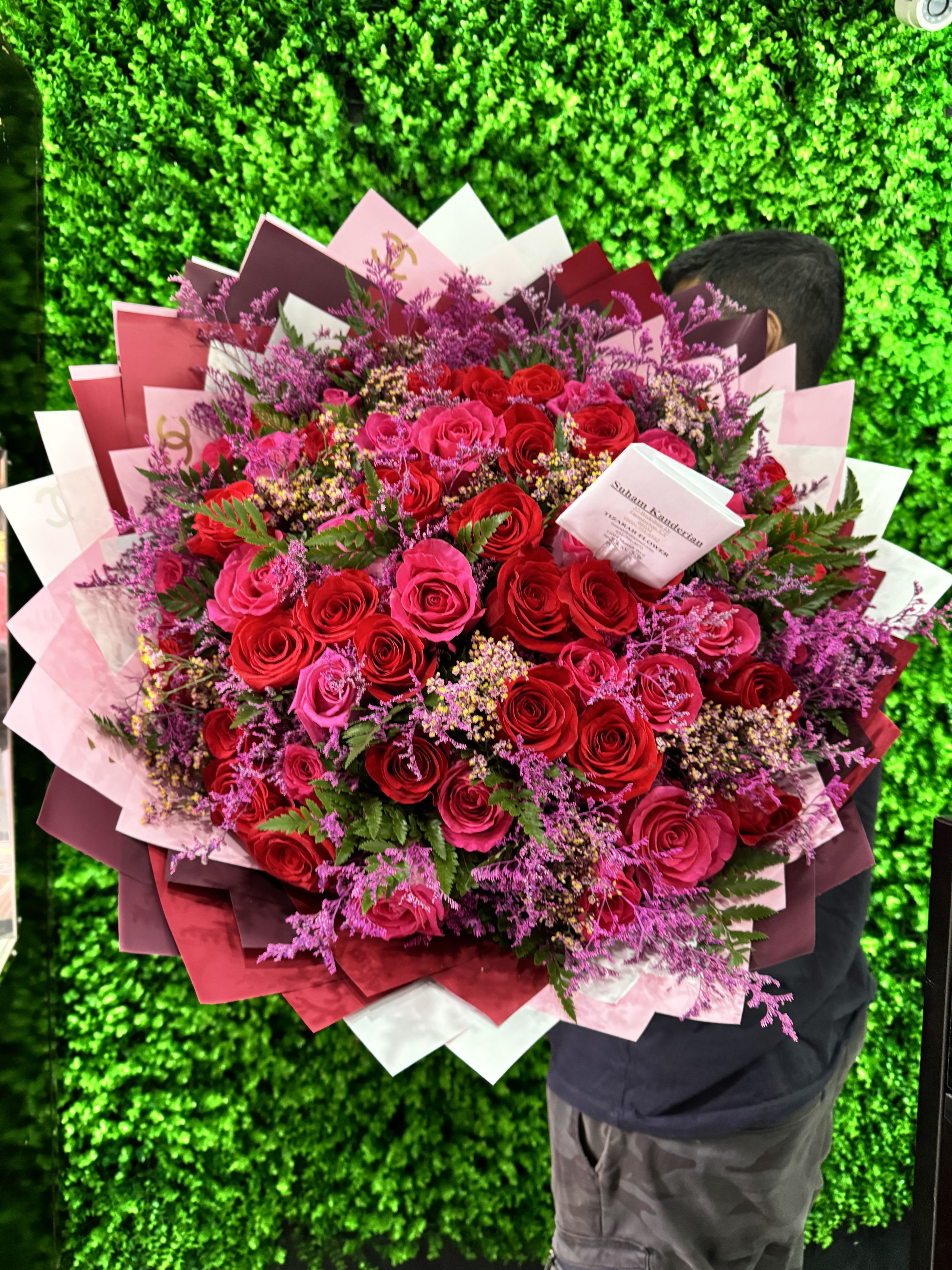Crimson Elegance - The &quot;Crimson Elegance&quot; bouquet is a captivating blend of rich red and soft pink roses, symbolizing passion, love, and grace. Accented with delicate purple fillers, this arrangement brings together bold romance and subtle charm. Perfect for expressing deep emotions, it’s ideal for anniversaries, romantic gestures, or to simply brighten someone’s day with beauty and elegance. Every bloom in this exquisite bouquet is handpicked and arranged to create a harmonious balance of color and texture, making it a timeless gift. 