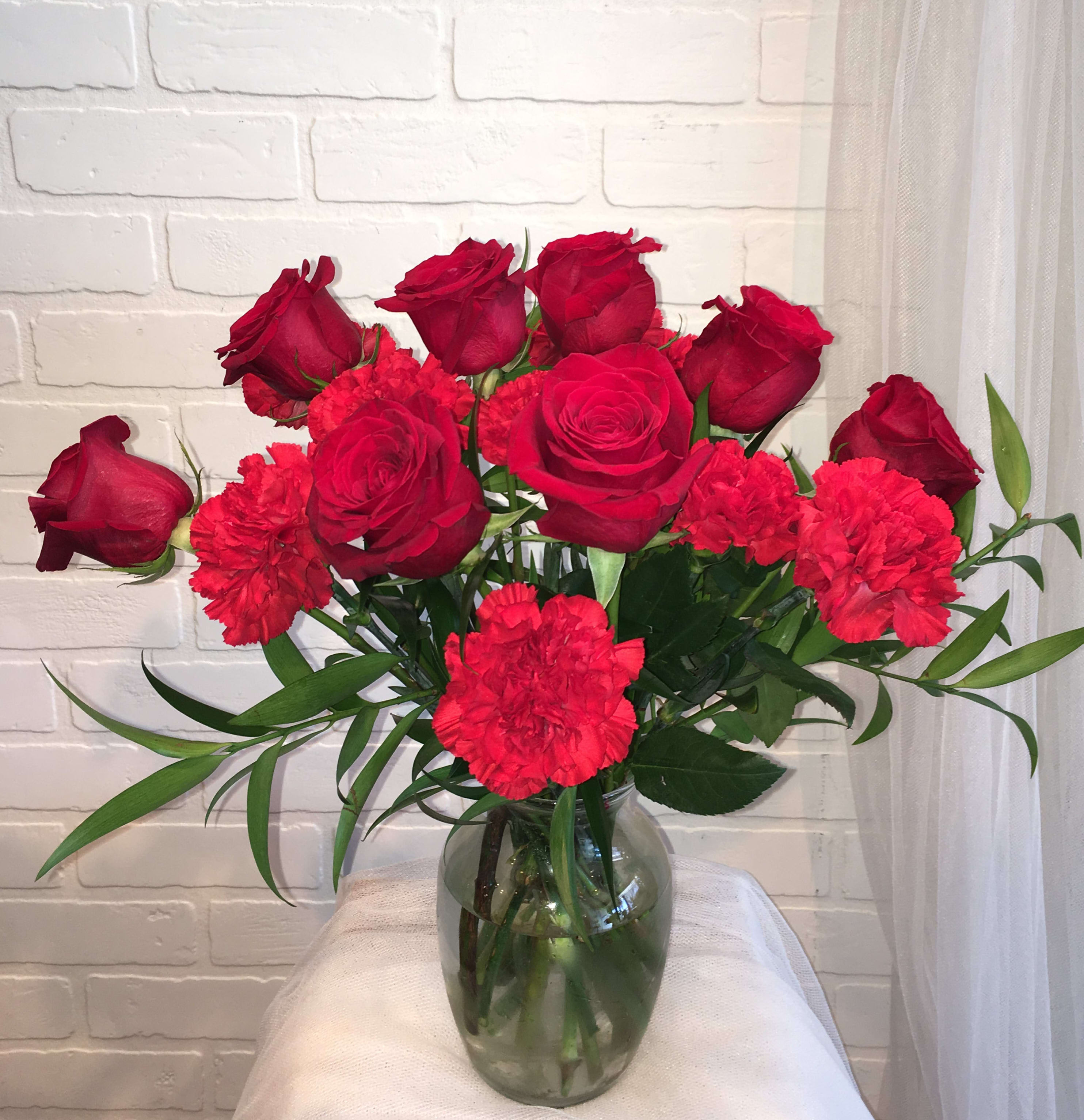Heart Full of Love Heart Full of Love - Includes: red roses, red carnations, greens, clear glass vase