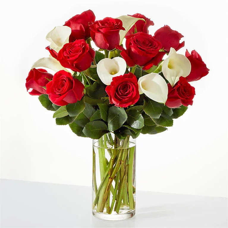 Be Mine Bouquet Be Mine Bouquet - Romance comes to life with this classic arrangement of red roses and white calla lilies.