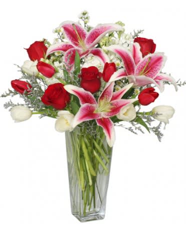 FANTASTIC FRAGRANCE FLOWER ARRANGEMENT - Along with rich red roses, this bouquet features red and white tulips, stock and Stargazer lilies. Our Fantastic Fragrance arrangement will leave a soft fragrance, as well as warm feelings of love in the air