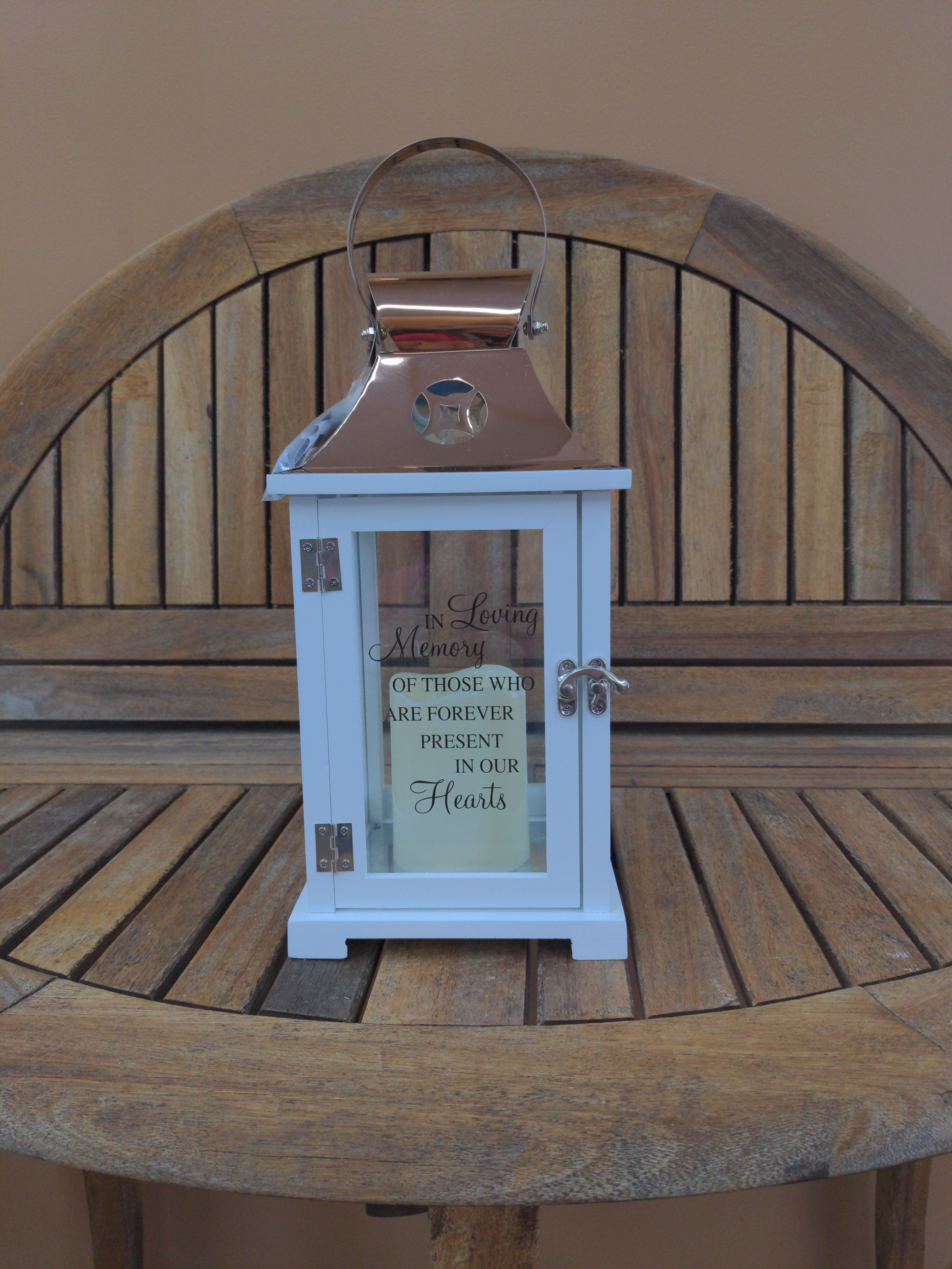 In Loving Memory Lantern White - 15&quot; by 7&quot; Lantern with flameless candle. Inscribed with In Loving Memory Of Those Who Are Forever Present In Our Hearts. 3 Triple A Batteries Required. Batteries Included