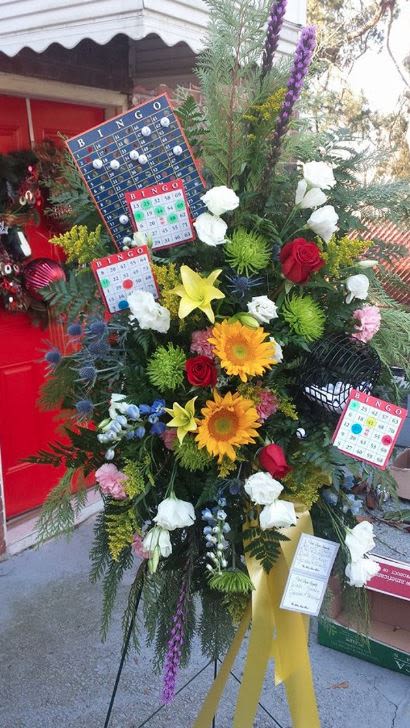 Bingo Themed Funeral Standing Spray Bingo Themed Funeral Standing Spray - Bingo Themed Funeral Standing Spray. Floral choice of colors and flowers used unless specified by customer.