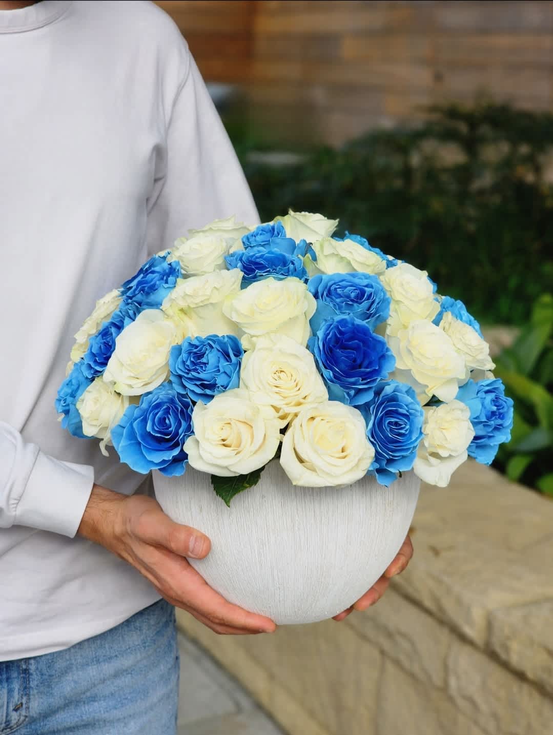 Blue Waves  - Introducing our exquisite white ceramic vase adorned with stunning blue and white roses, embodying elegance and luxury. Perfect for any occasion, elevate your love with something truly special. 