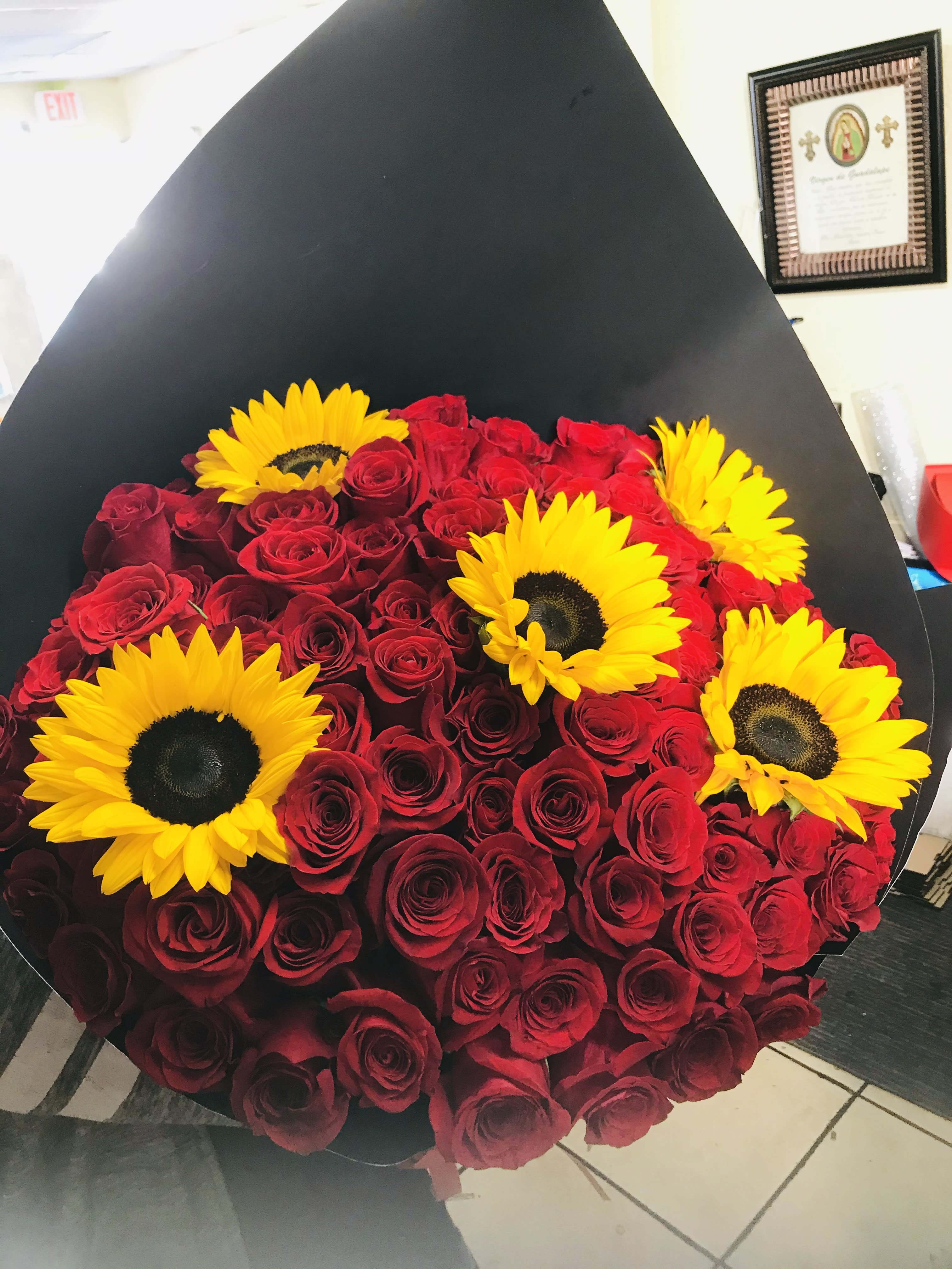 6 Dozen red roses & 5 sunflowers 6 Dozen red roses & 5 sunflowers - 6 dozen red roses and sunflowers